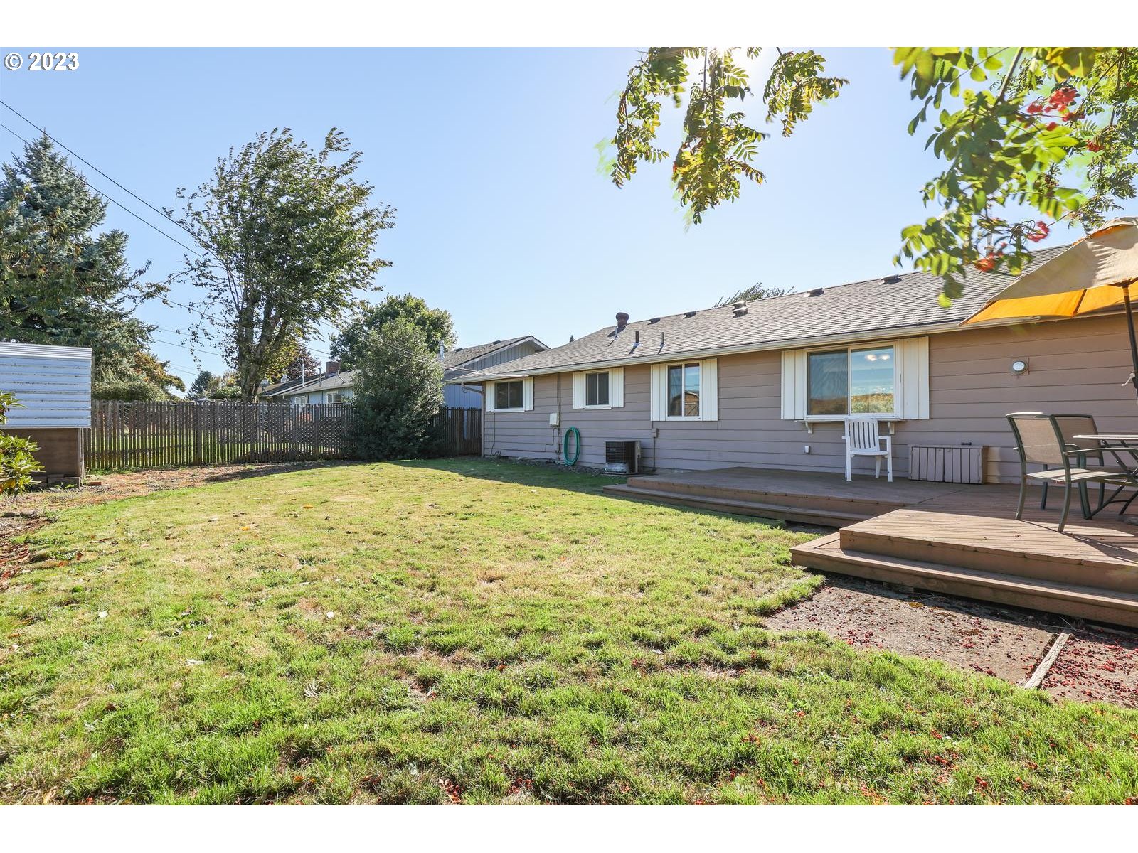 23921 Southeast Oak Street Gresham, OR 97030 - Photo 15 of 46 a view of house with yard outdoor seating and barbeque oven