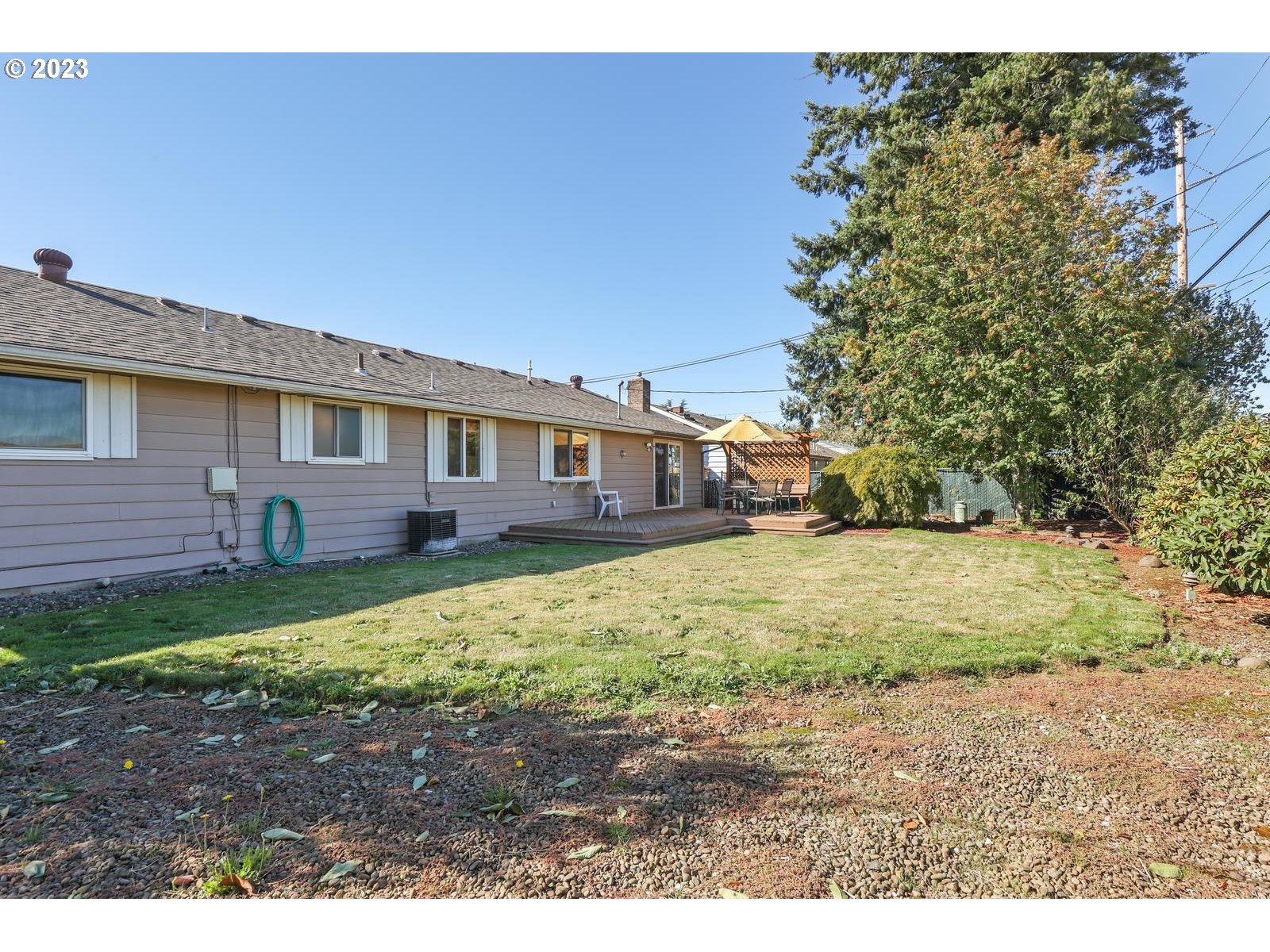 23921 Southeast Oak Street Gresham, OR 97030 - Photo 18 of 46 a view of a yard in front of a house with a large tree