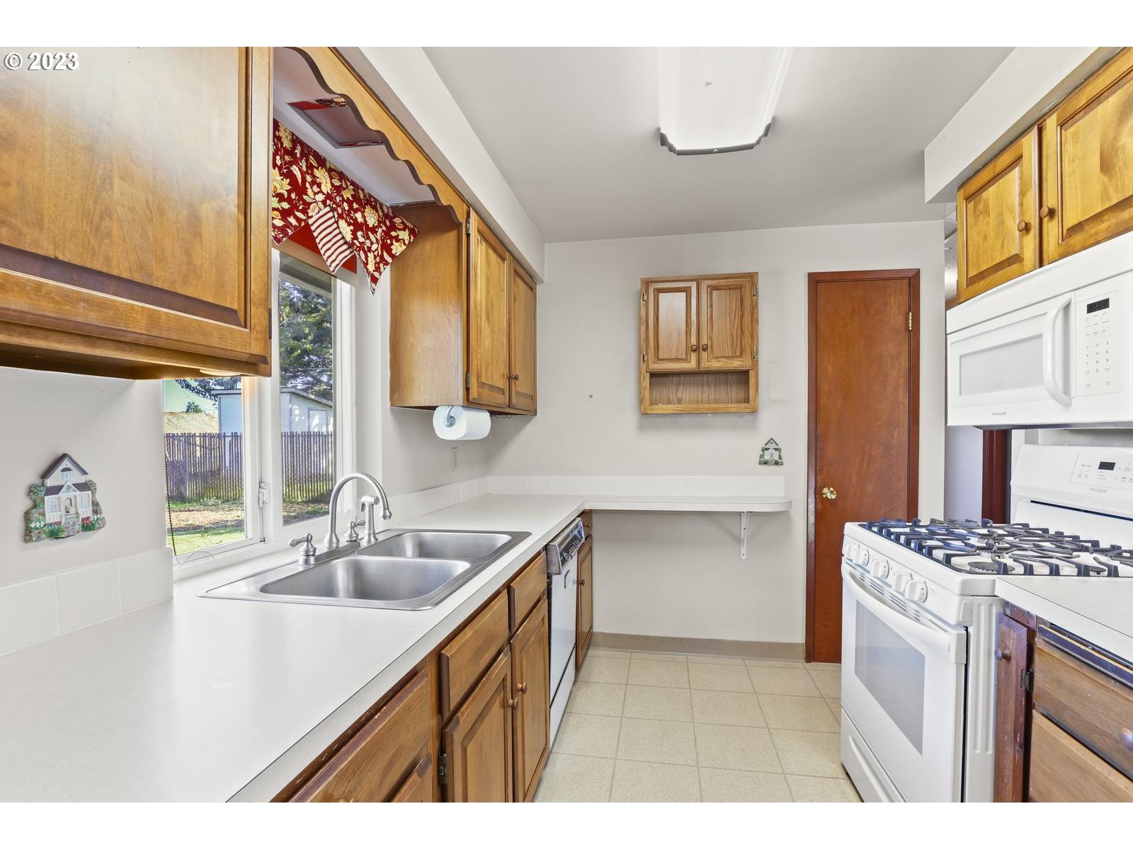 23921 Southeast Oak Street Gresham, OR 97030 - Photo 32 of 46 a kitchen with a sink cabinets and window