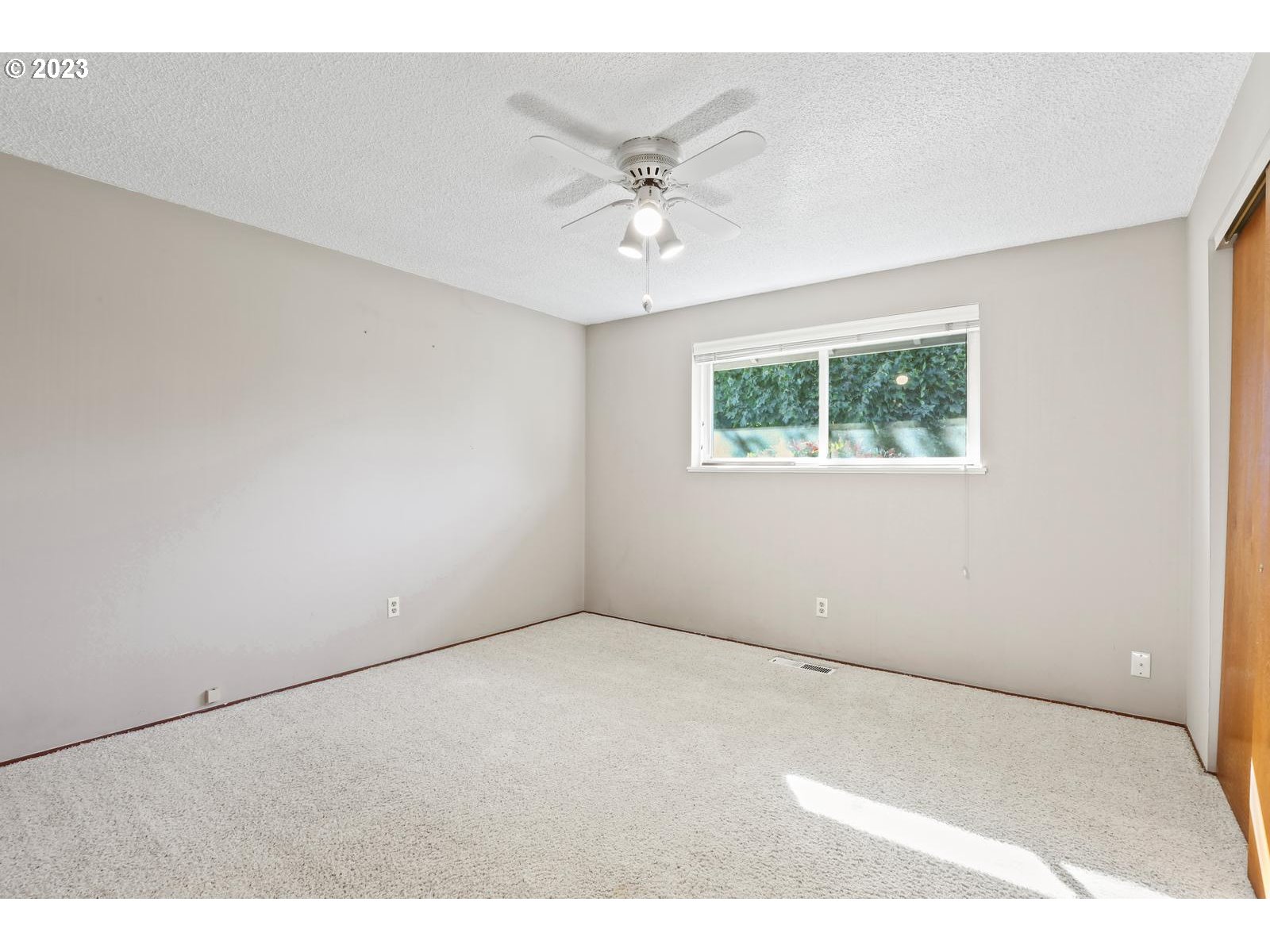 23921 Southeast Oak Street Gresham, OR 97030 - Photo 46 of 46 a view of an empty room with a ceiling fan
