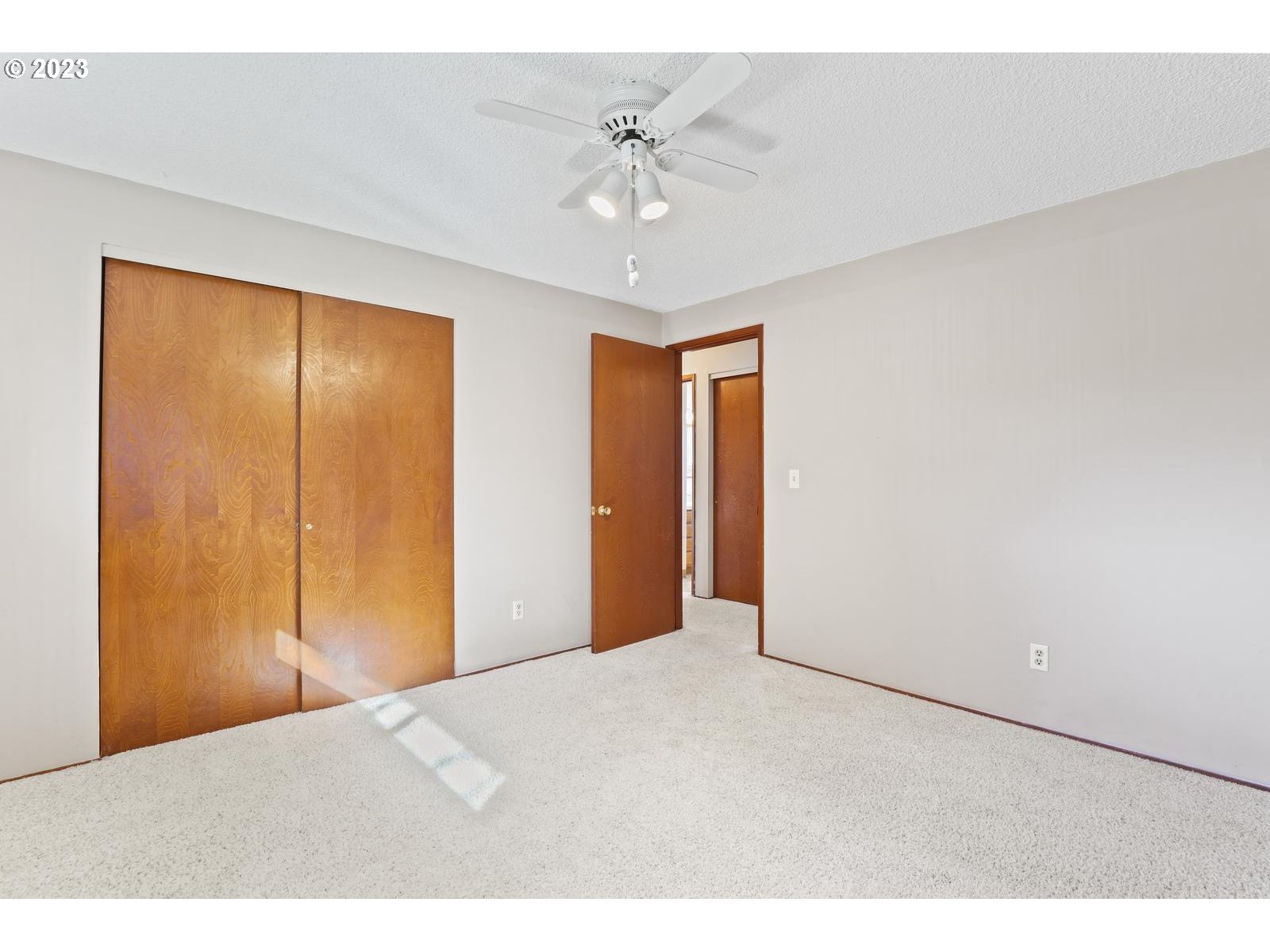 23921 Southeast Oak Street Gresham, OR 97030 - Photo 5 of 46 a view of an empty room with a ceiling fan