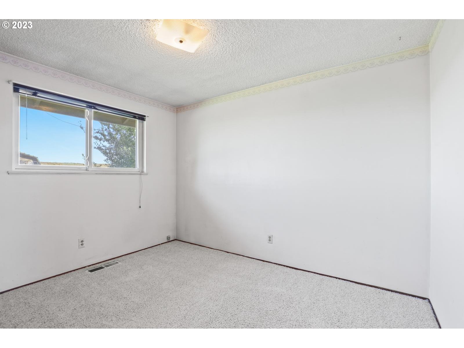 23921 Southeast Oak Street Gresham, OR 97030 - Photo 7 of 46 an empty room with windows