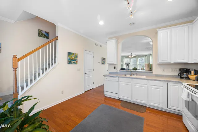 a view of staircase with wooden floor and stairs