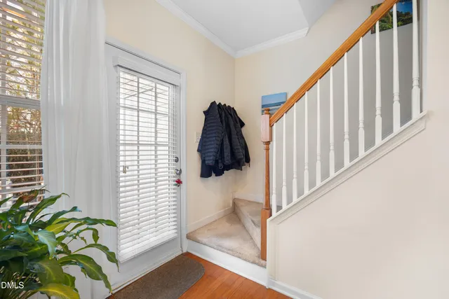 a spacious bedroom with a bed and a large window