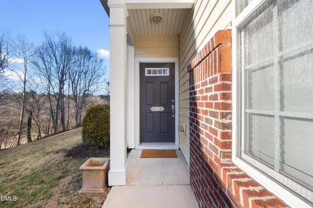 a living room with furniture window and wooden floor