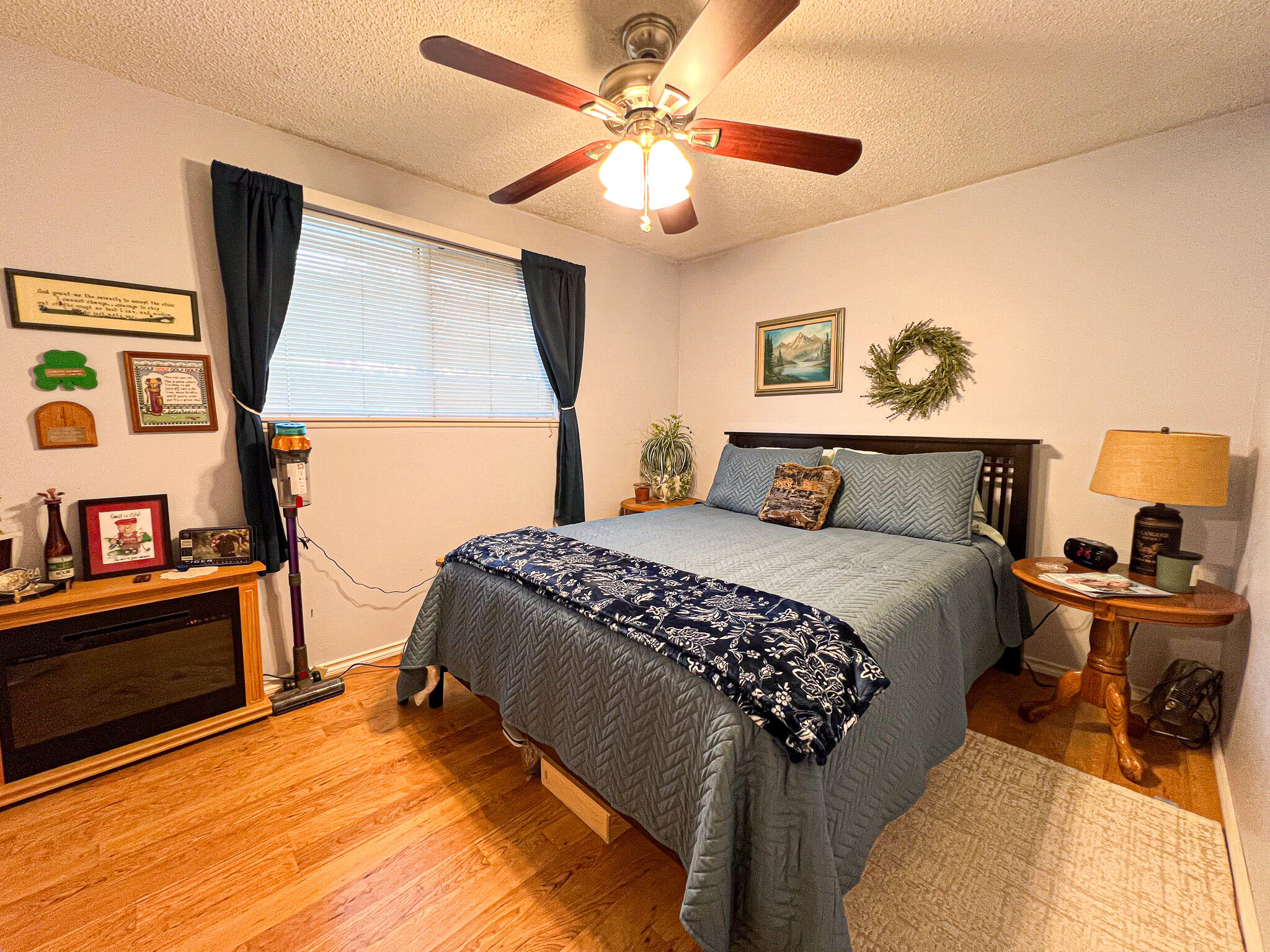 1225 East B Street Fossil, OR 97830 - Photo 17 of 33 a bedroom with a bed and wooden floor