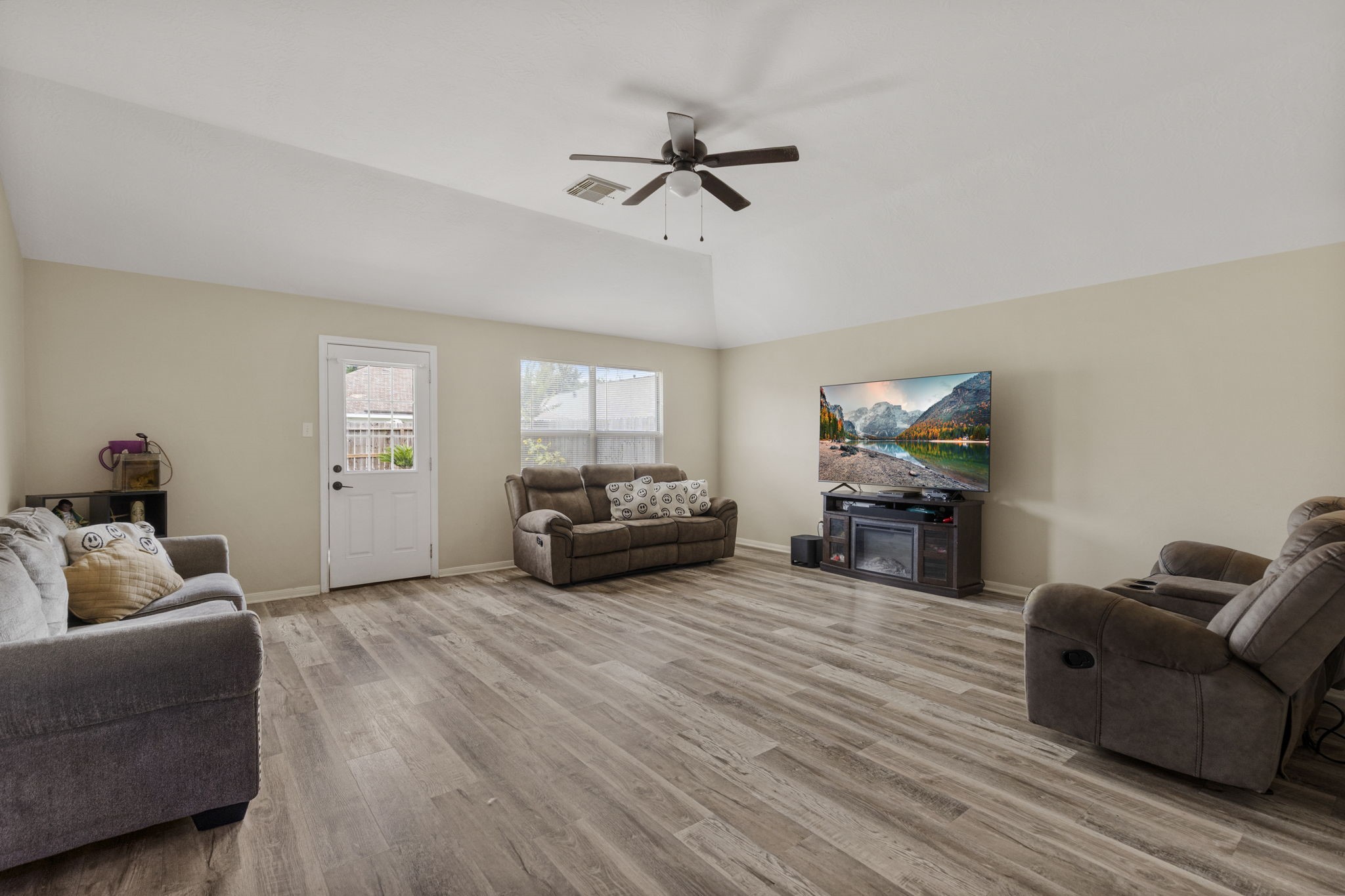 29106 Foxingham Circle Spring, TX 77386 - Photo 17 of 47 a living room with furniture and a flat screen tv