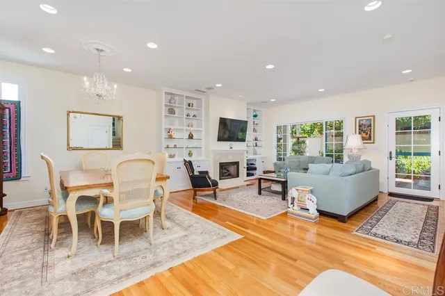 a living room with furniture wooden floor and a fireplace