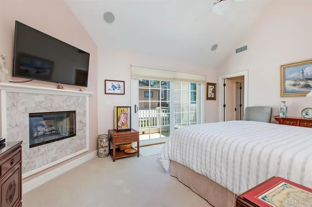 a bedroom with a bed and a television