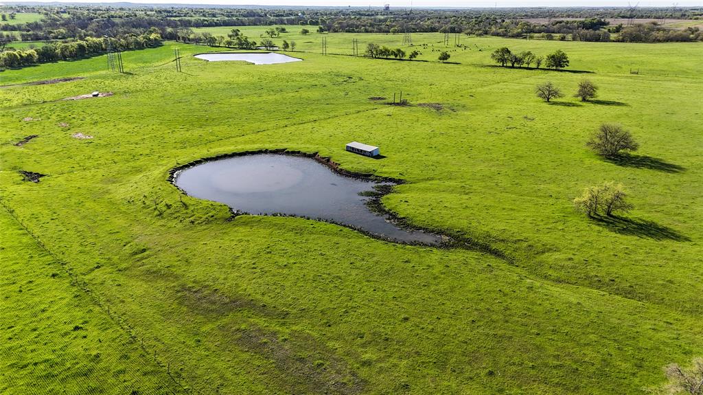 2007 Valley View Valley View, TX 76272 - Photo 3 of 10 View of rural area featuring a nearby body of water and a pastoral area