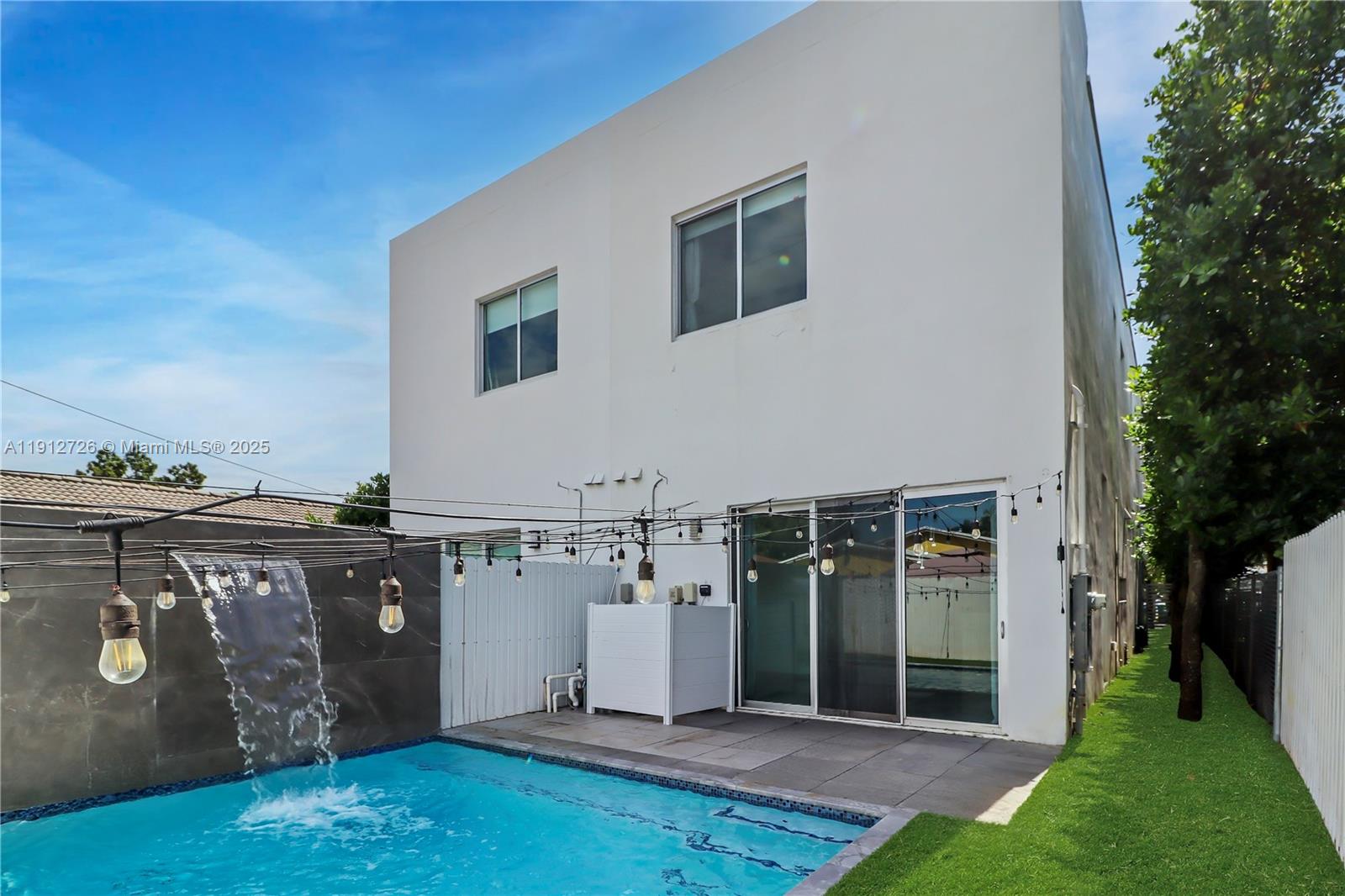 3461 Southwest 25th Street, Unit A Miami, FL 33133 - Photo 2 of 26 a view of a house with a yard