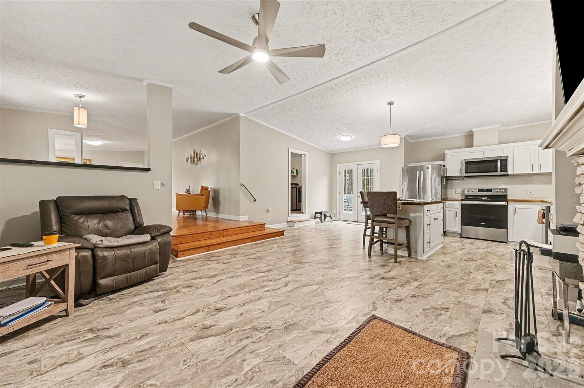 5018 Duncan Road Monroe, NC 28110 - Photo 15 of 33 a living room with furniture and kitchen view