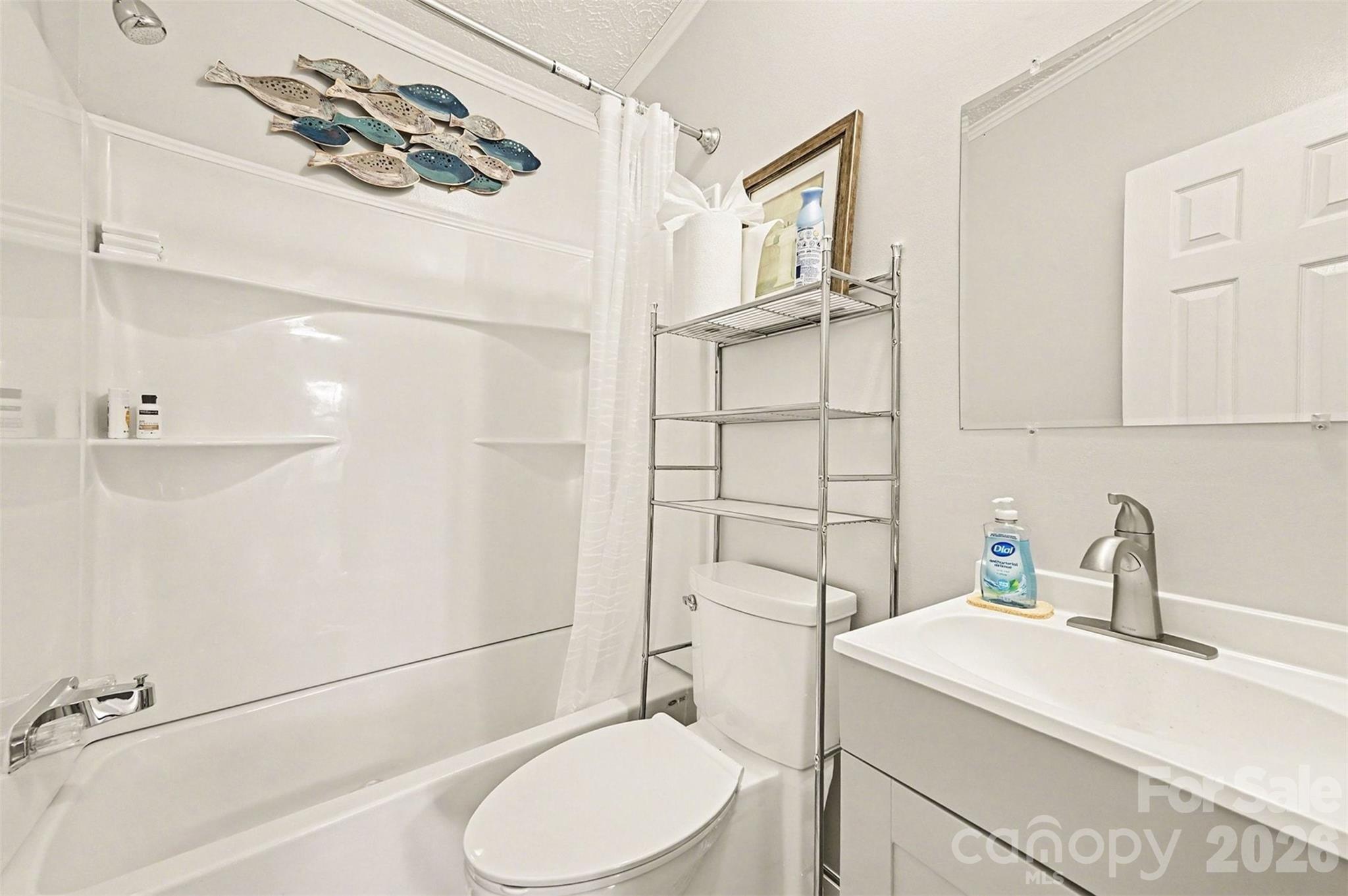 5018 Duncan Road Monroe, NC 28110 - Photo 17 of 33 a bathroom with a sink a toilet and shower