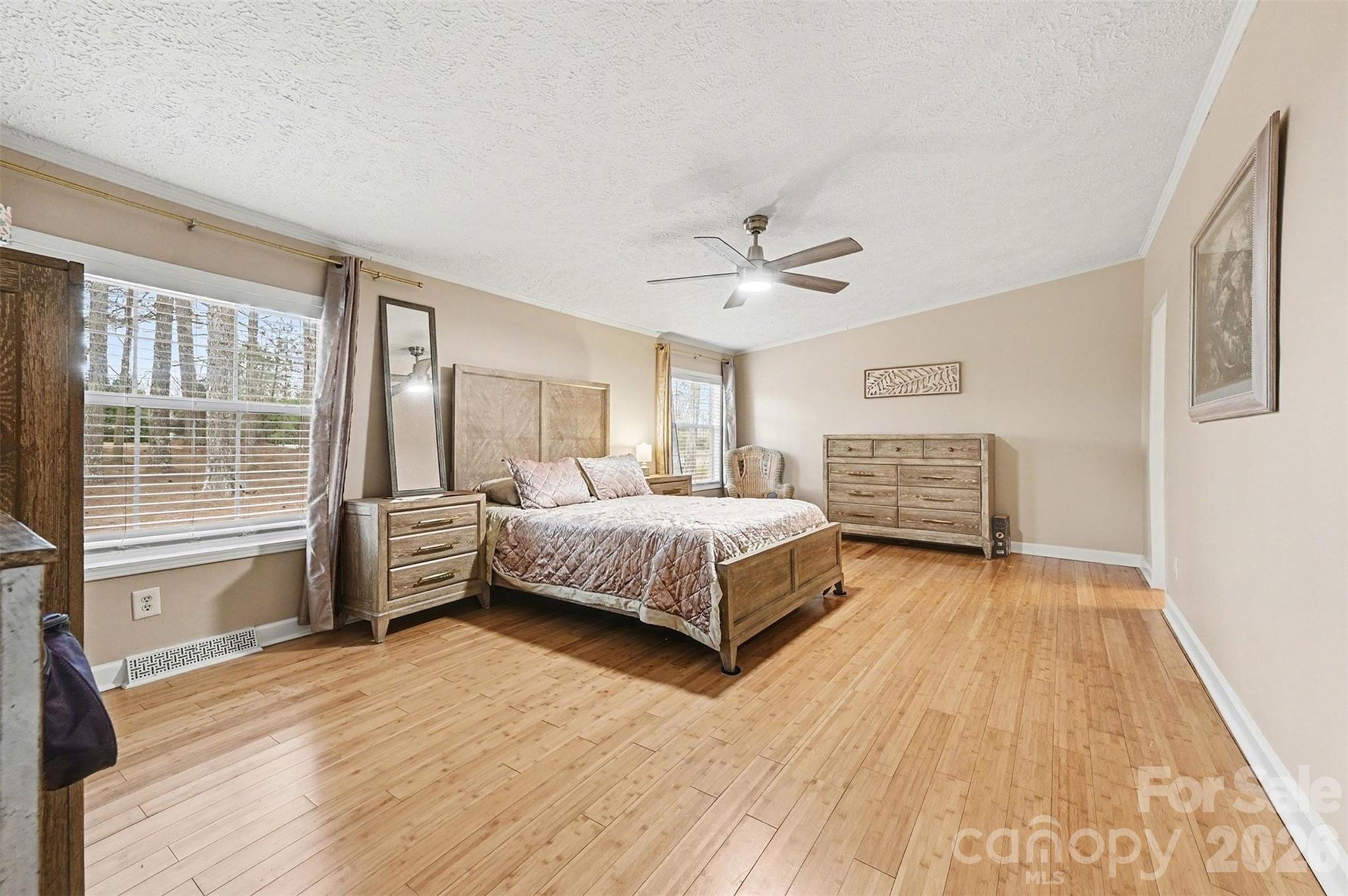 5018 Duncan Road Monroe, NC 28110 - Photo 20 of 33 a bedroom with a bed and wooden floor