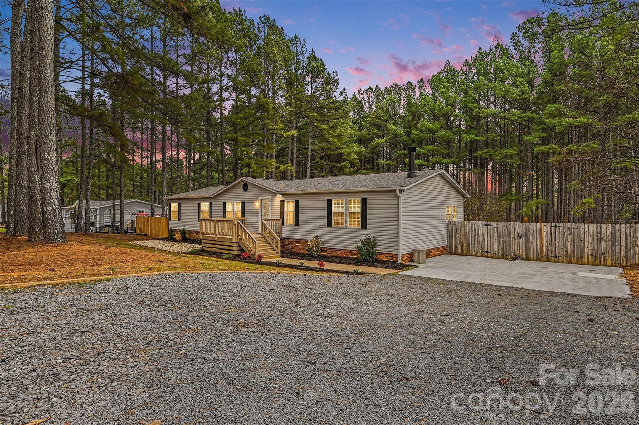 5018 Duncan Road Monroe, NC 28110 - Photo 2 of 33 a view of a house with backyard and sitting area