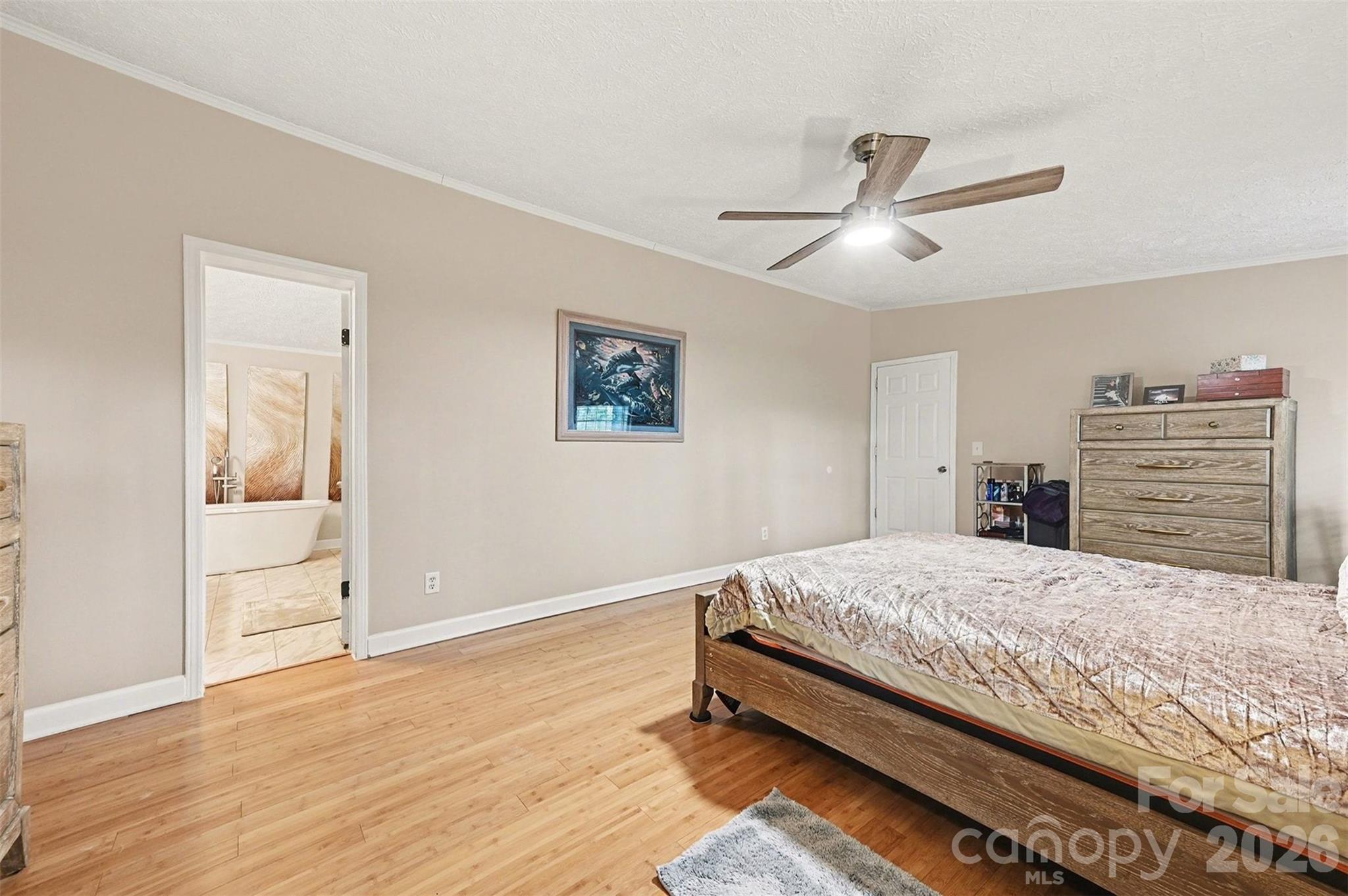 5018 Duncan Road Monroe, NC 28110 - Photo 21 of 33 a bedroom with a bed and wooden floor