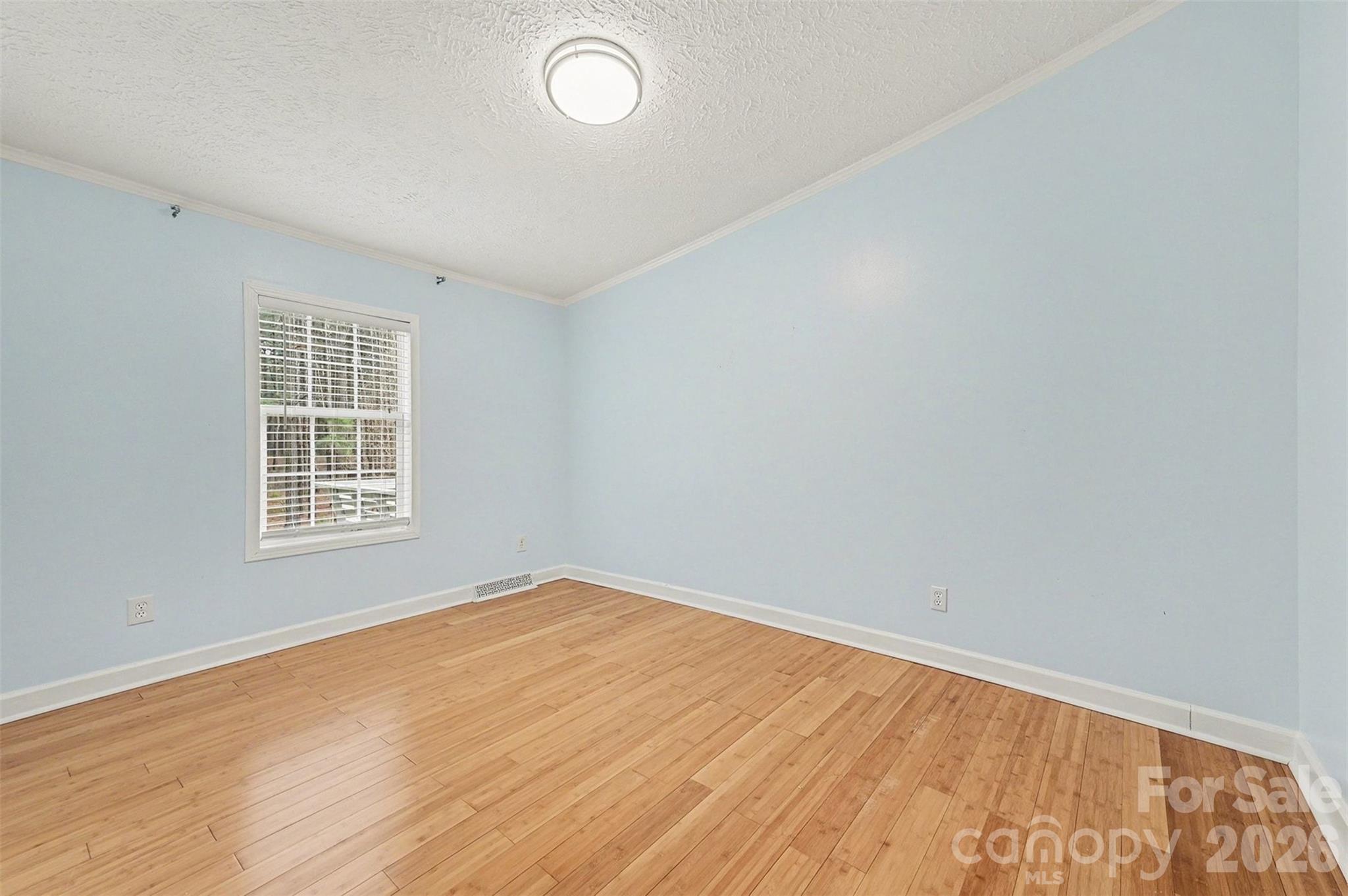 5018 Duncan Road Monroe, NC 28110 - Photo 27 of 33 a view of an empty room with wooden floor and a window