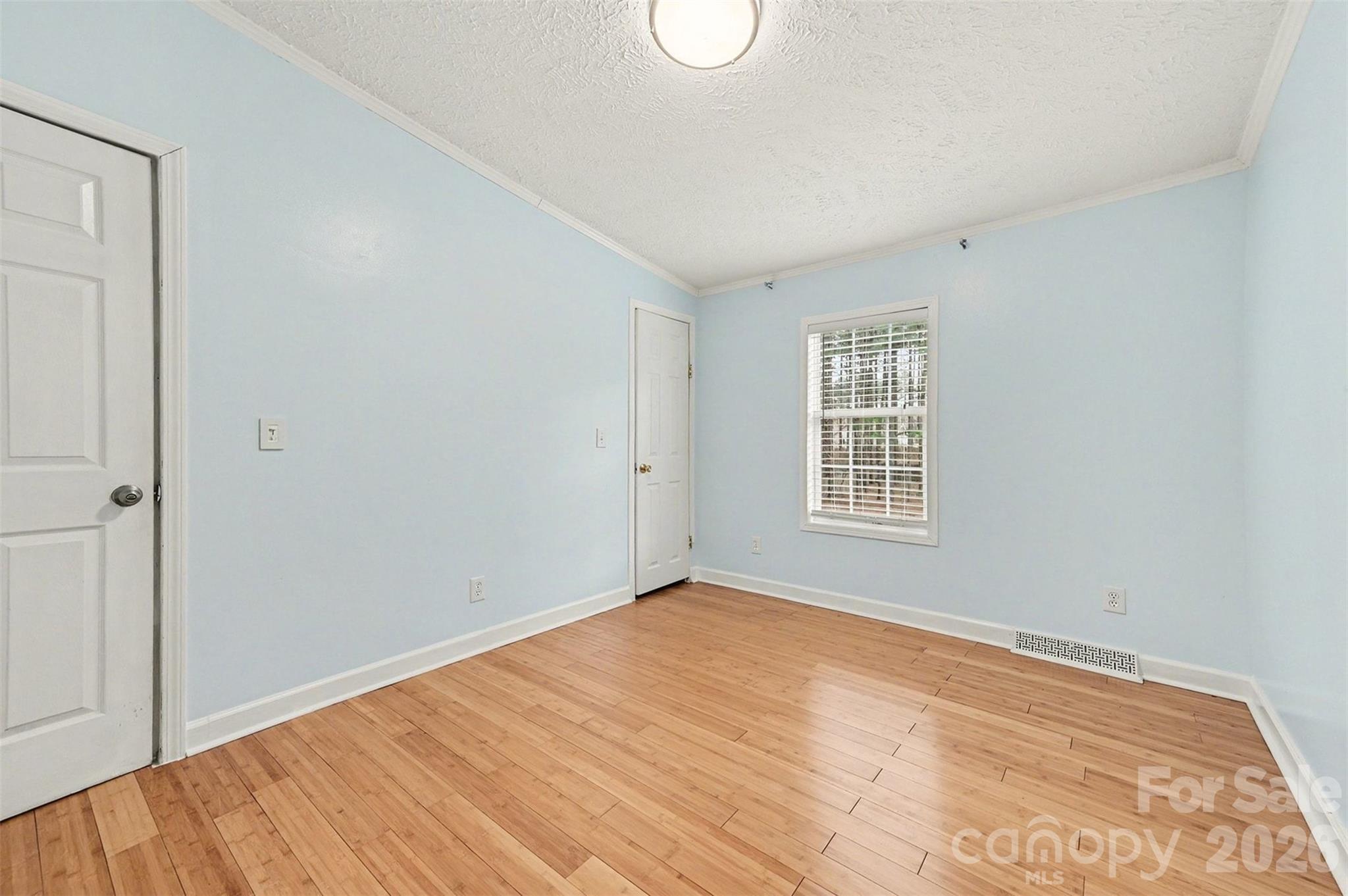 5018 Duncan Road Monroe, NC 28110 - Photo 28 of 33 a view of an empty room with wooden floor and a window