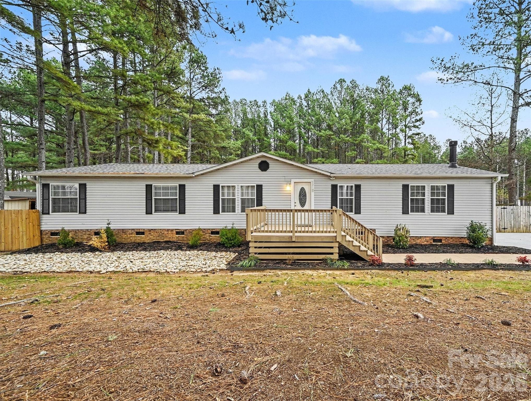 5018 Duncan Road Monroe, NC 28110 - Photo 4 of 33 a view of a house with a yard