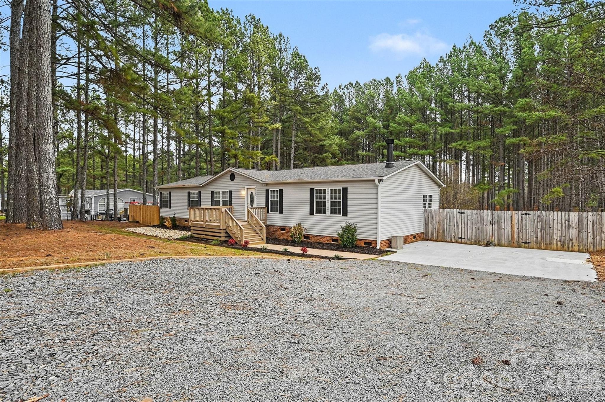 5018 Duncan Road Monroe, NC 28110 - Photo 5 of 33 a view of a house with backyard and sitting area