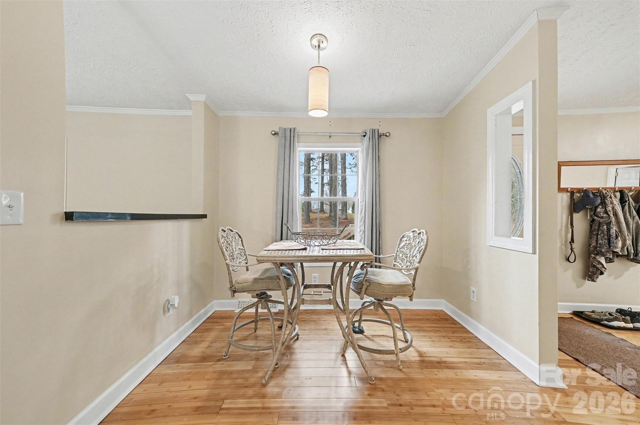 5018 Duncan Road Monroe, NC 28110 - Photo 10 of 33 a view of a dining room with furniture window and wooden floor