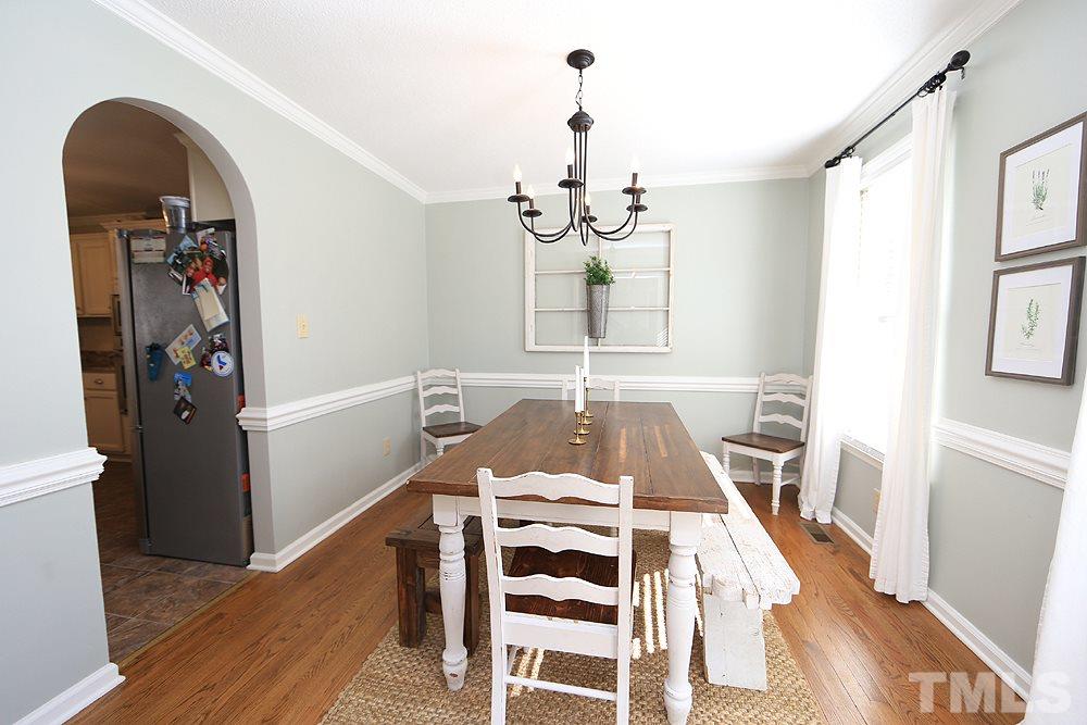 5029 Denham Court Raleigh, NC 27613 - Photo 2 of 13 a view of a dining room with wooden floor