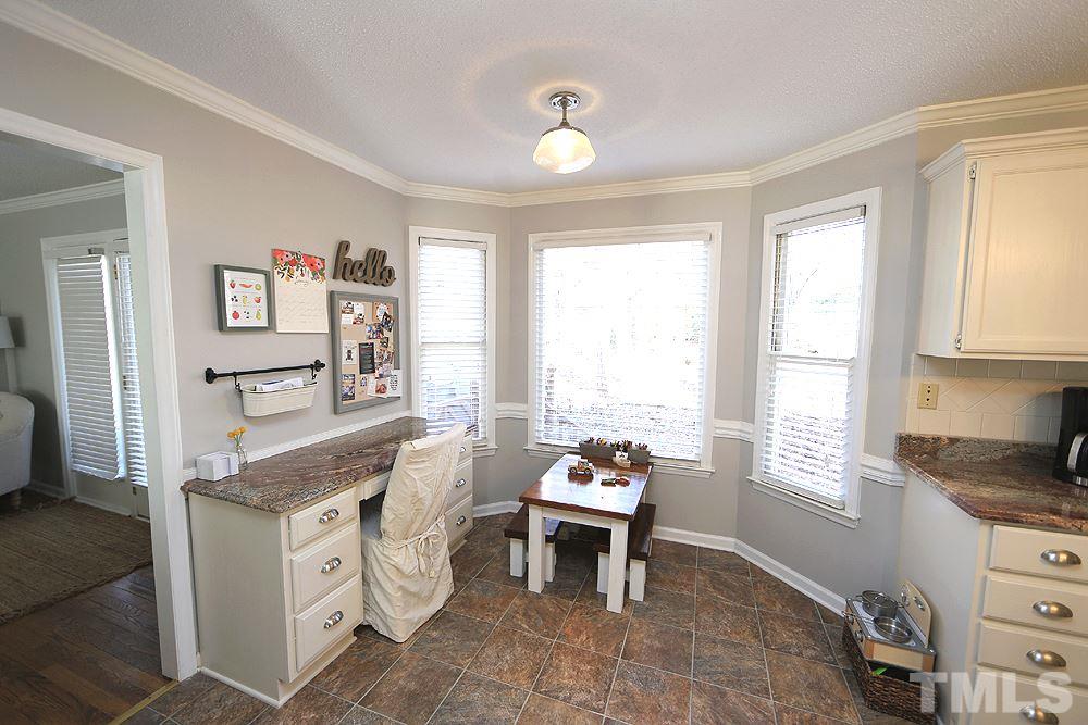 5029 Denham Court Raleigh, NC 27613 - Photo 6 of 13 a spacious bedroom with a bed and a window