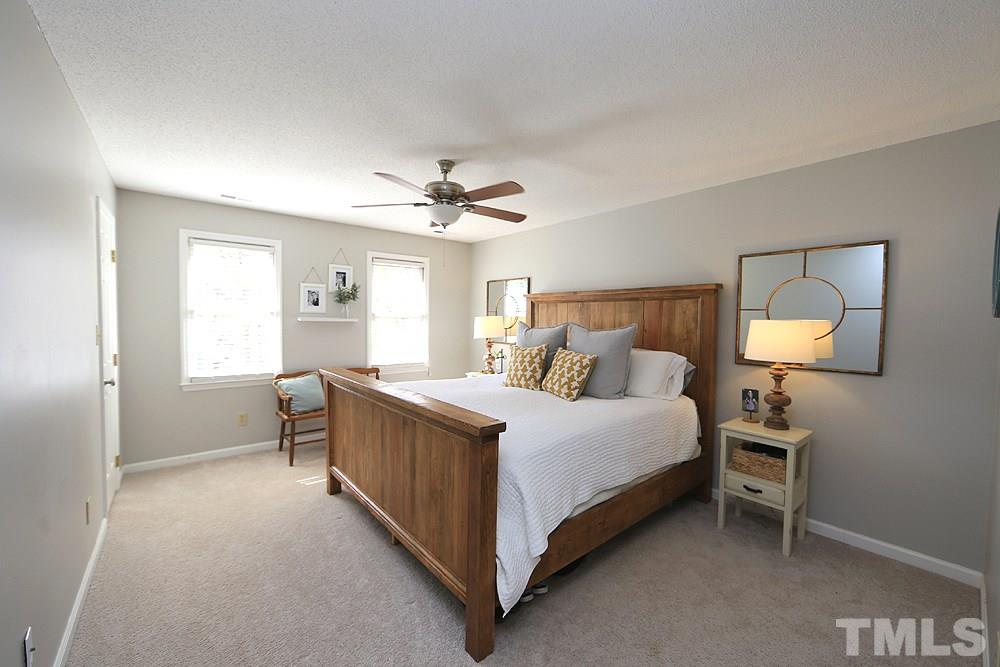 5029 Denham Court Raleigh, NC 27613 - Photo 7 of 13 a bed room with a bed and a tv