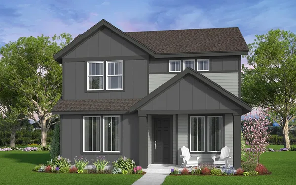 a front view of a house with a garden and plants