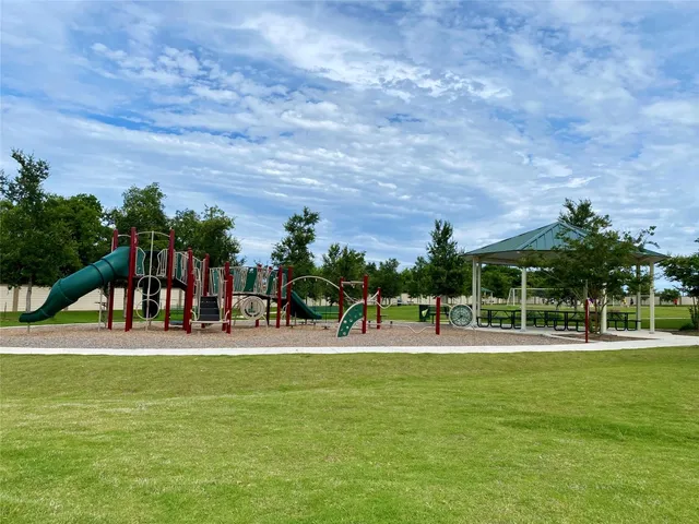 a view of a swimming pool with an outdoor space and seating area