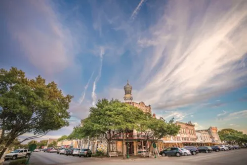 a view of street with parked cars