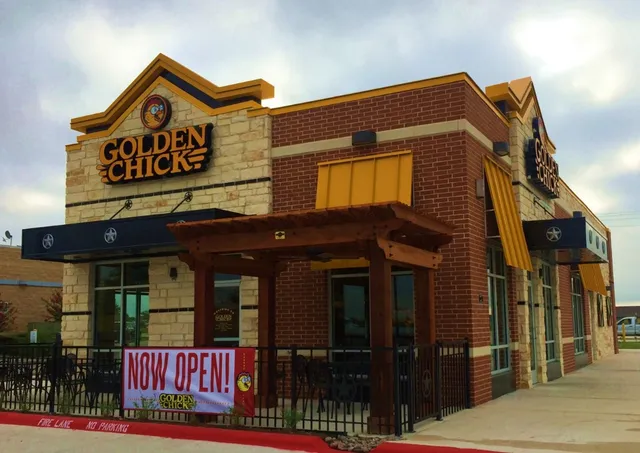 a view of a brick building with a large window