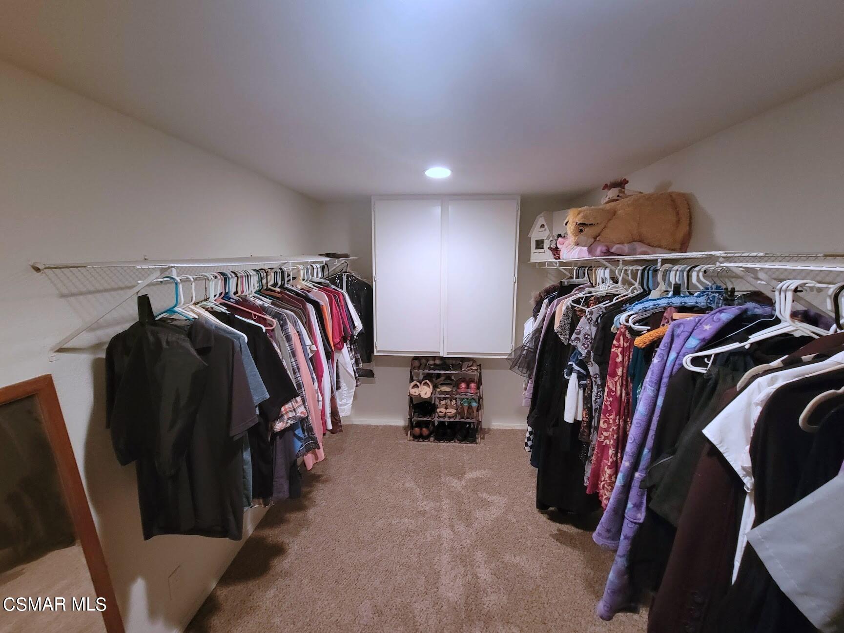 4306 Shopping Lane Simi Valley, CA 93063 - Photo 12 of 15 a view of walk in closet with clothes and shoes