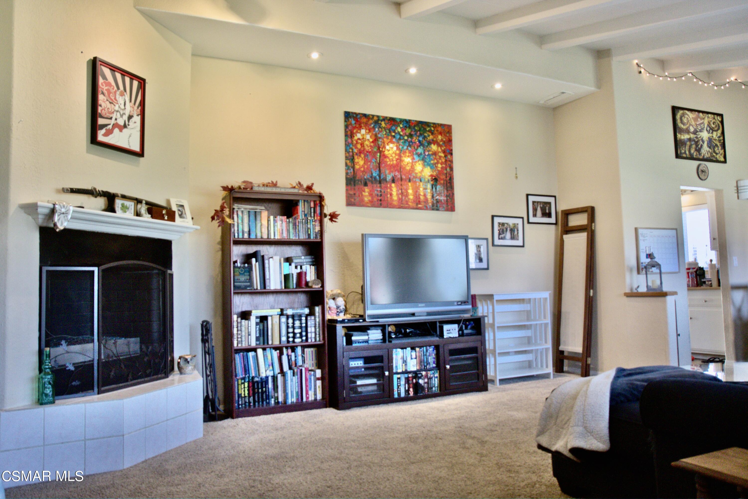 4306 Shopping Lane Simi Valley, CA 93063 - Photo 3 of 15 a living room with furniture and a flat screen tv