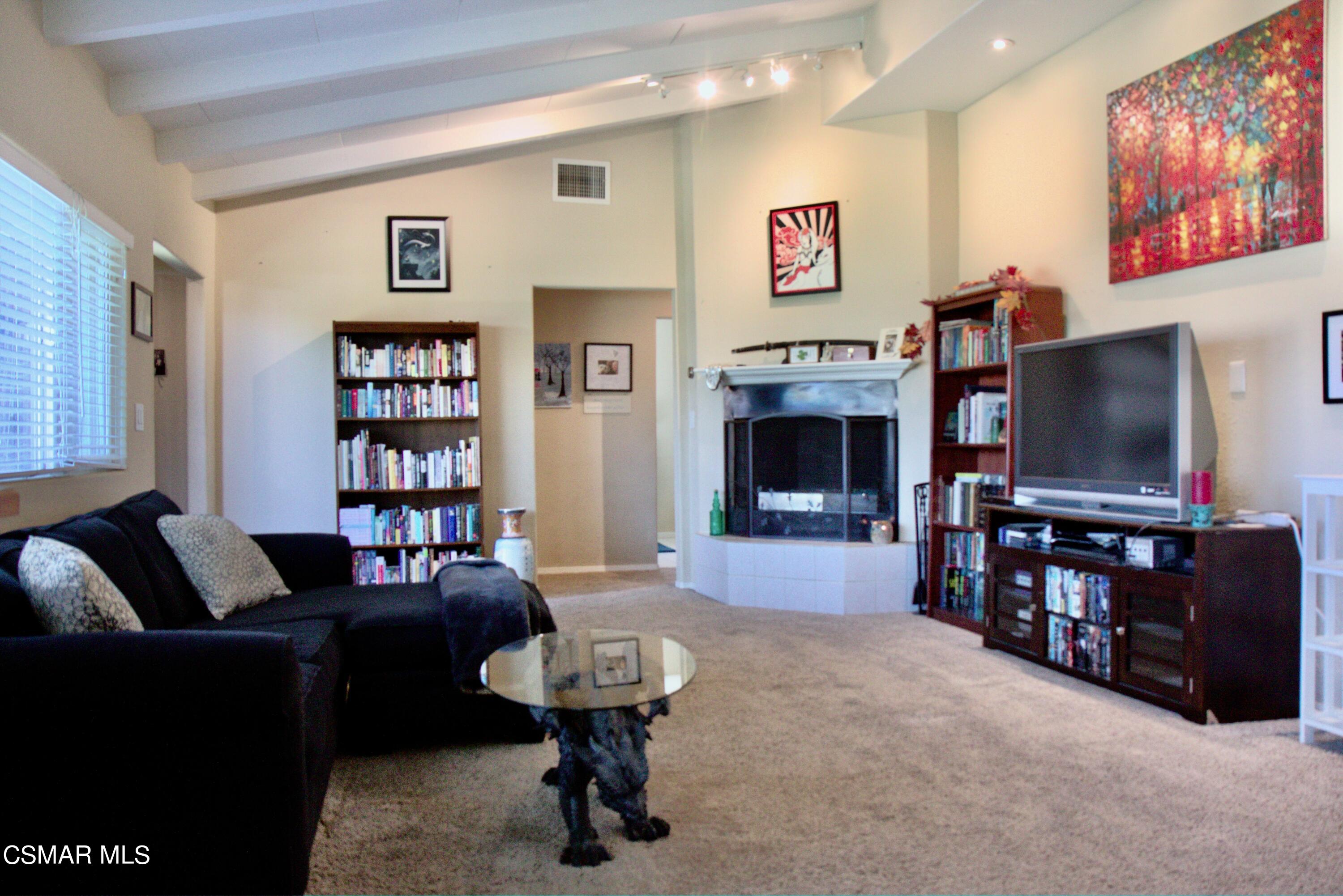 4306 Shopping Lane Simi Valley, CA 93063 - Photo 4 of 15 a living room with furniture and a flat screen tv