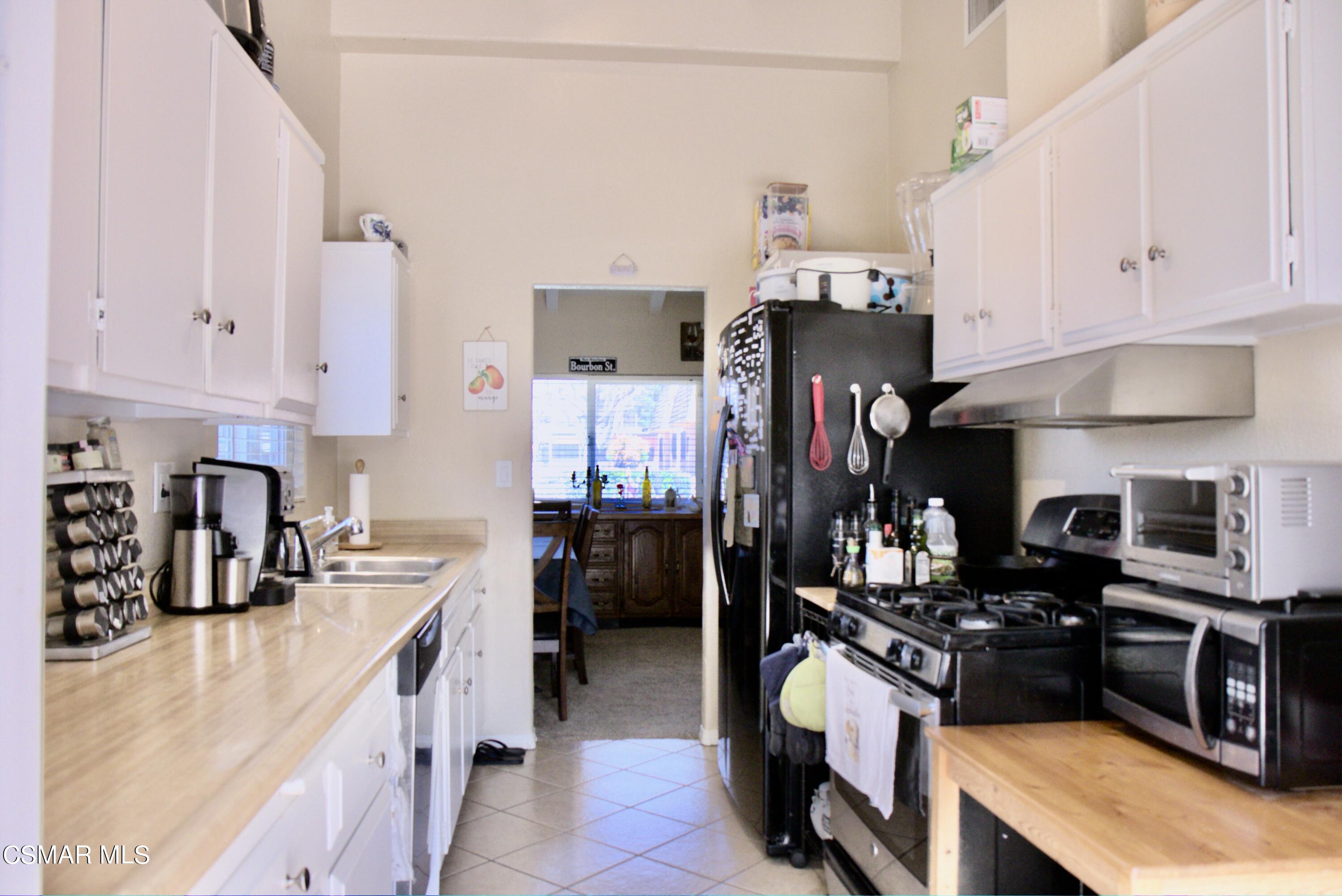 4306 Shopping Lane Simi Valley, CA 93063 - Photo 6 of 15 a kitchen with a stove and a refrigerator