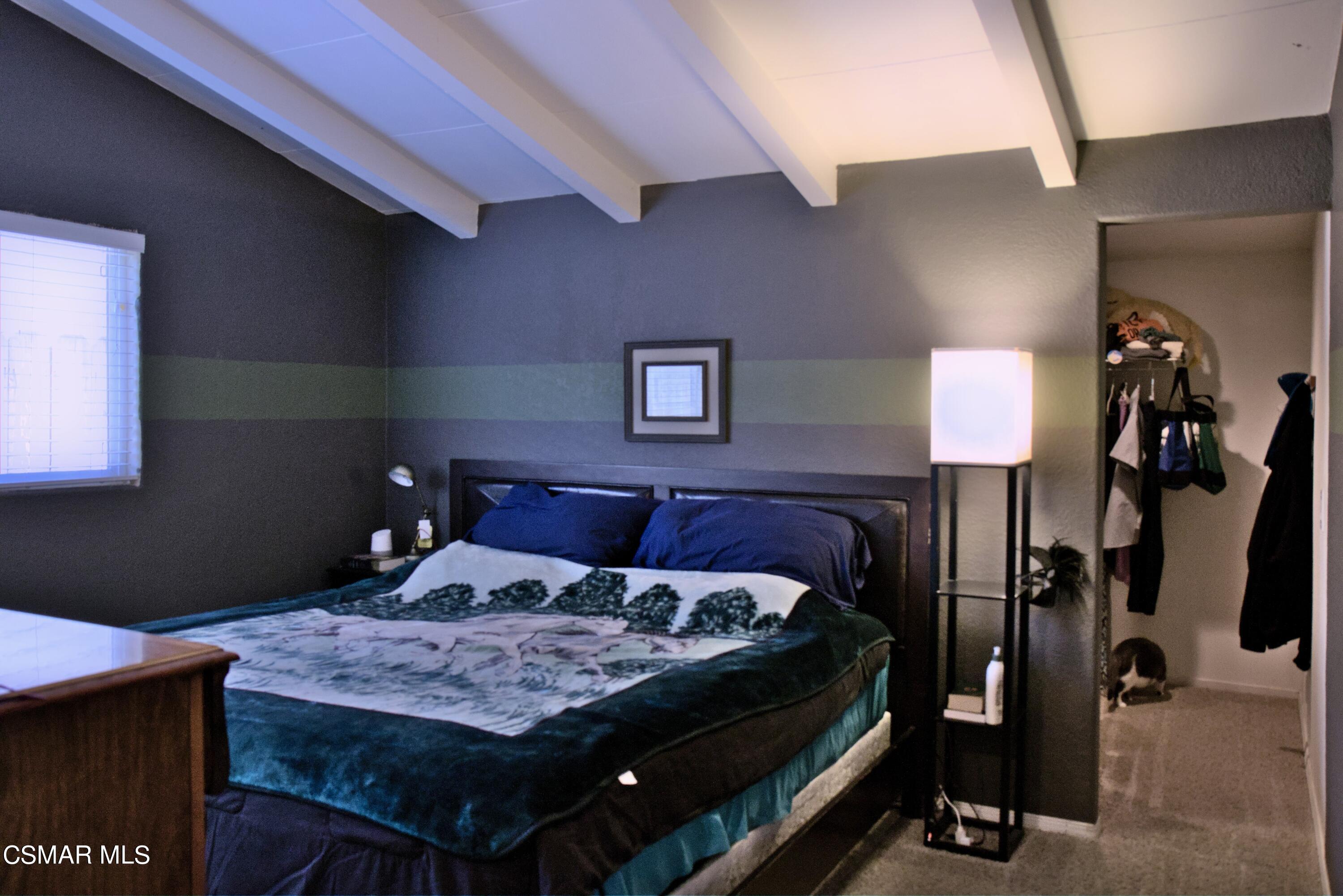 4306 Shopping Lane Simi Valley, CA 93063 - Photo 10 of 15 a bed sitting in a bedroom next to a lamp