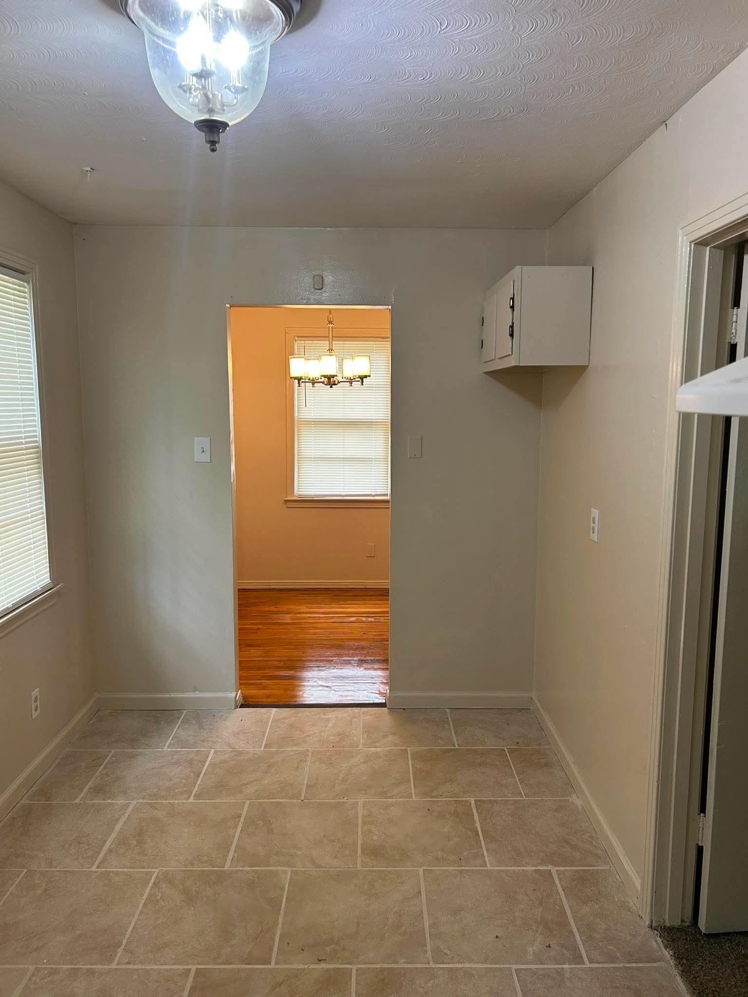 1510 Gausco Road Memphis, TN 38106 - Photo 3 of 10 Light-toned tile flooring in a rectangular pattern