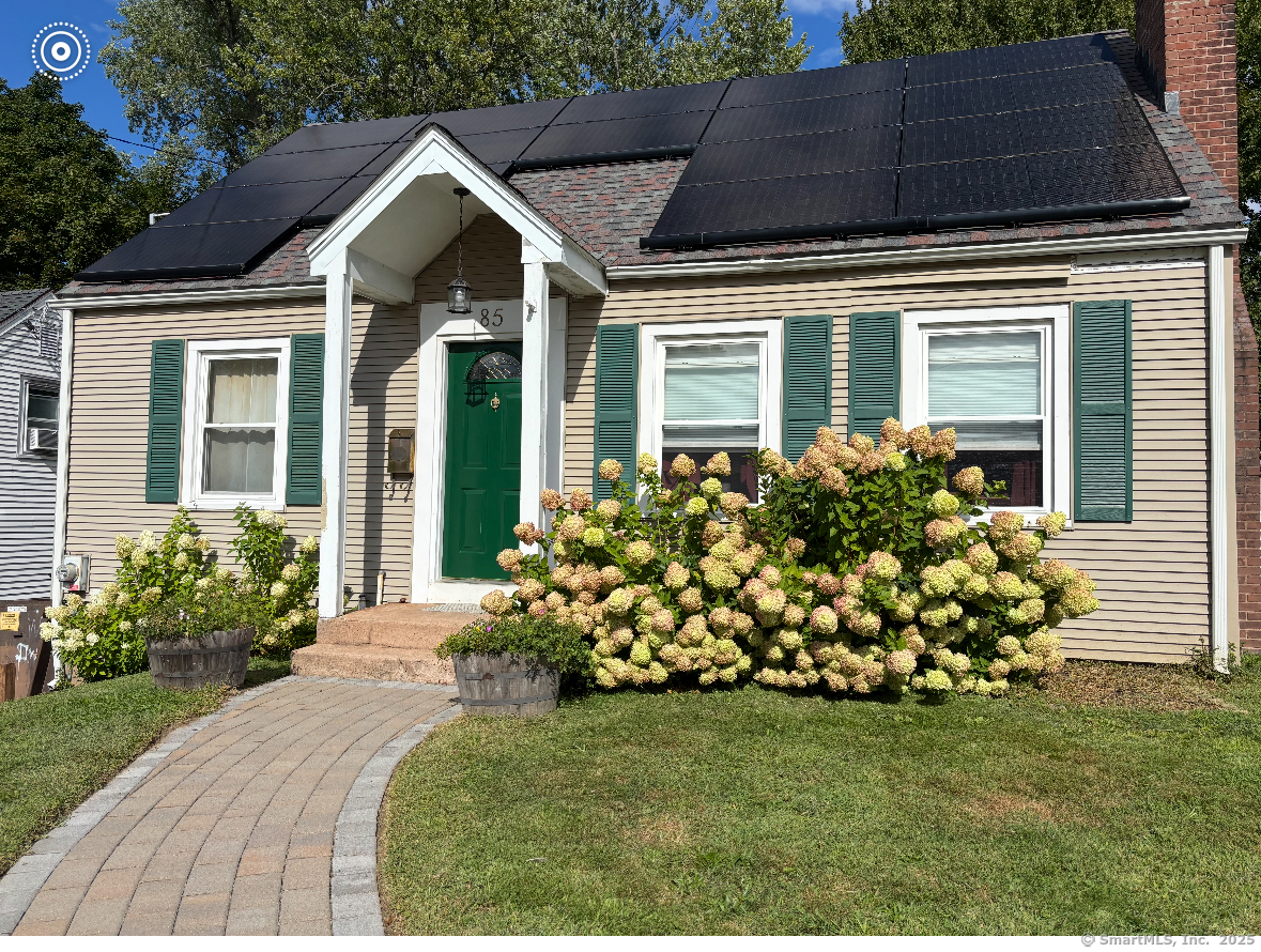 85 Benton Street Manchester, CT 06040 - Photo 1 of 34 a front view of a house with a garden