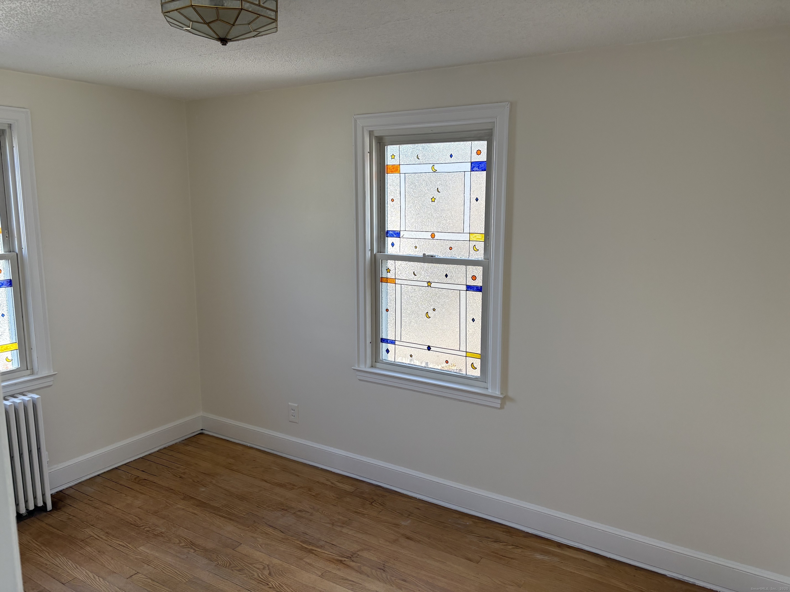 85 Benton Street Manchester, CT 06040 - Photo 16 of 34 wooden floor in an empty room