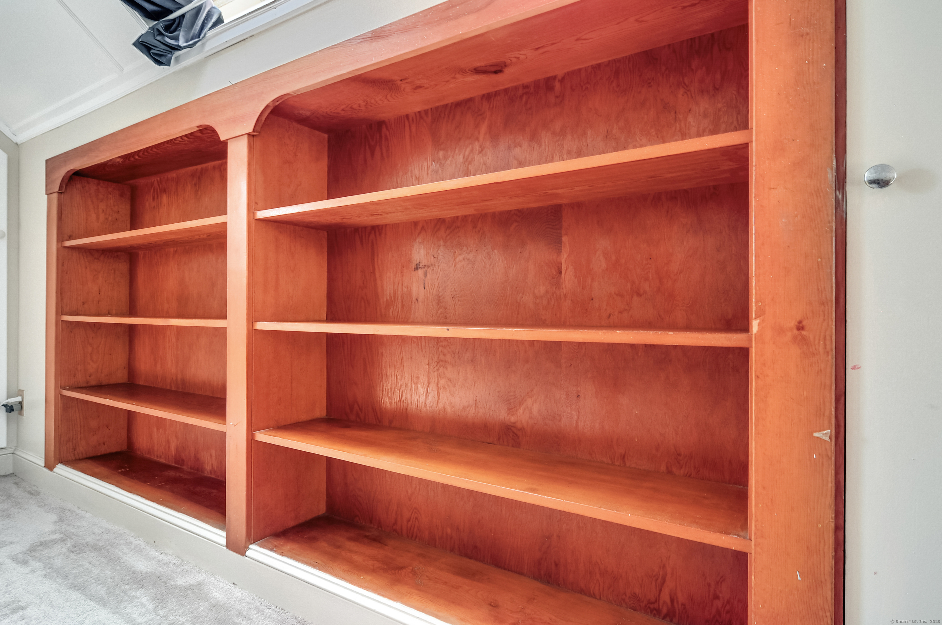 85 Benton Street Manchester, CT 06040 - Photo 23 of 34 a view of walk in closet with empty racks