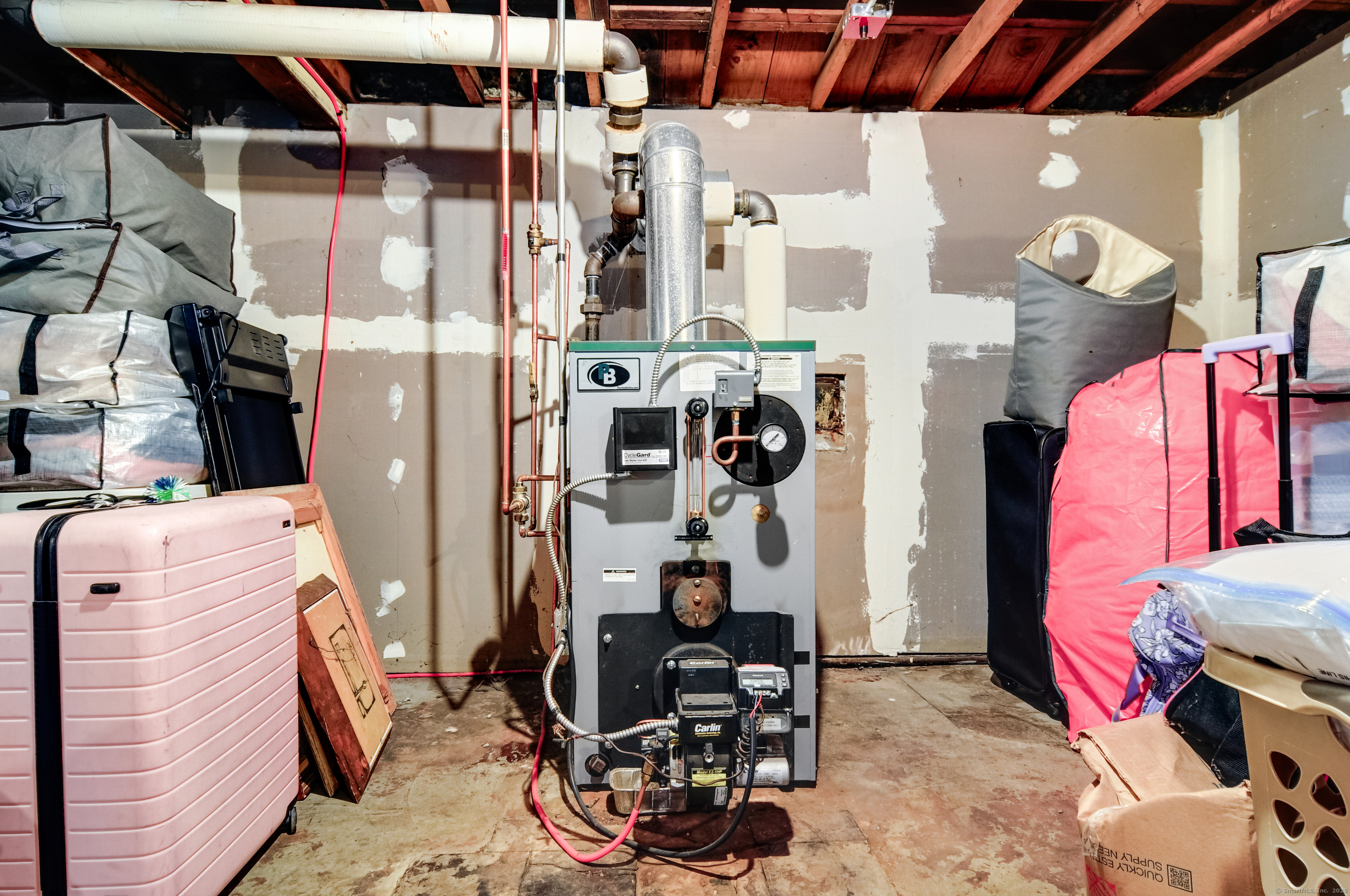 85 Benton Street Manchester, CT 06040 - Photo 26 of 34 a view of walk in closet with clothes and shoes