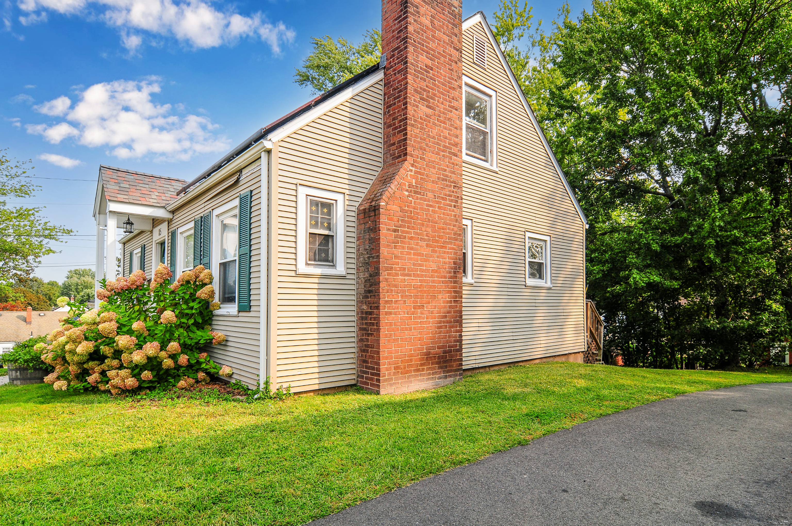 85 Benton Street Manchester, CT 06040 - Photo 27 of 34 a view of a house with a yard