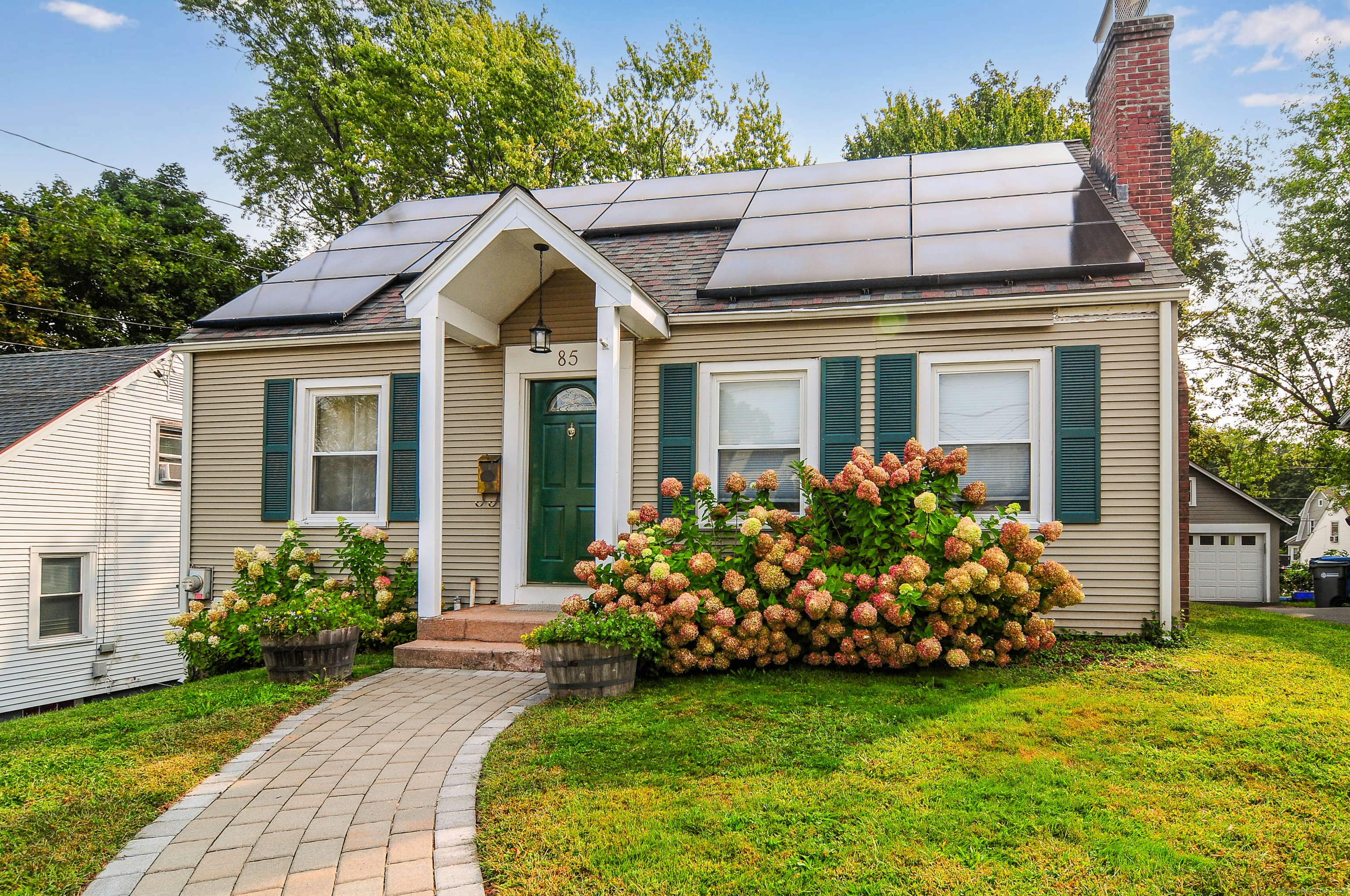 85 Benton Street Manchester, CT 06040 - Photo 34 of 34 a front view of a house with garden