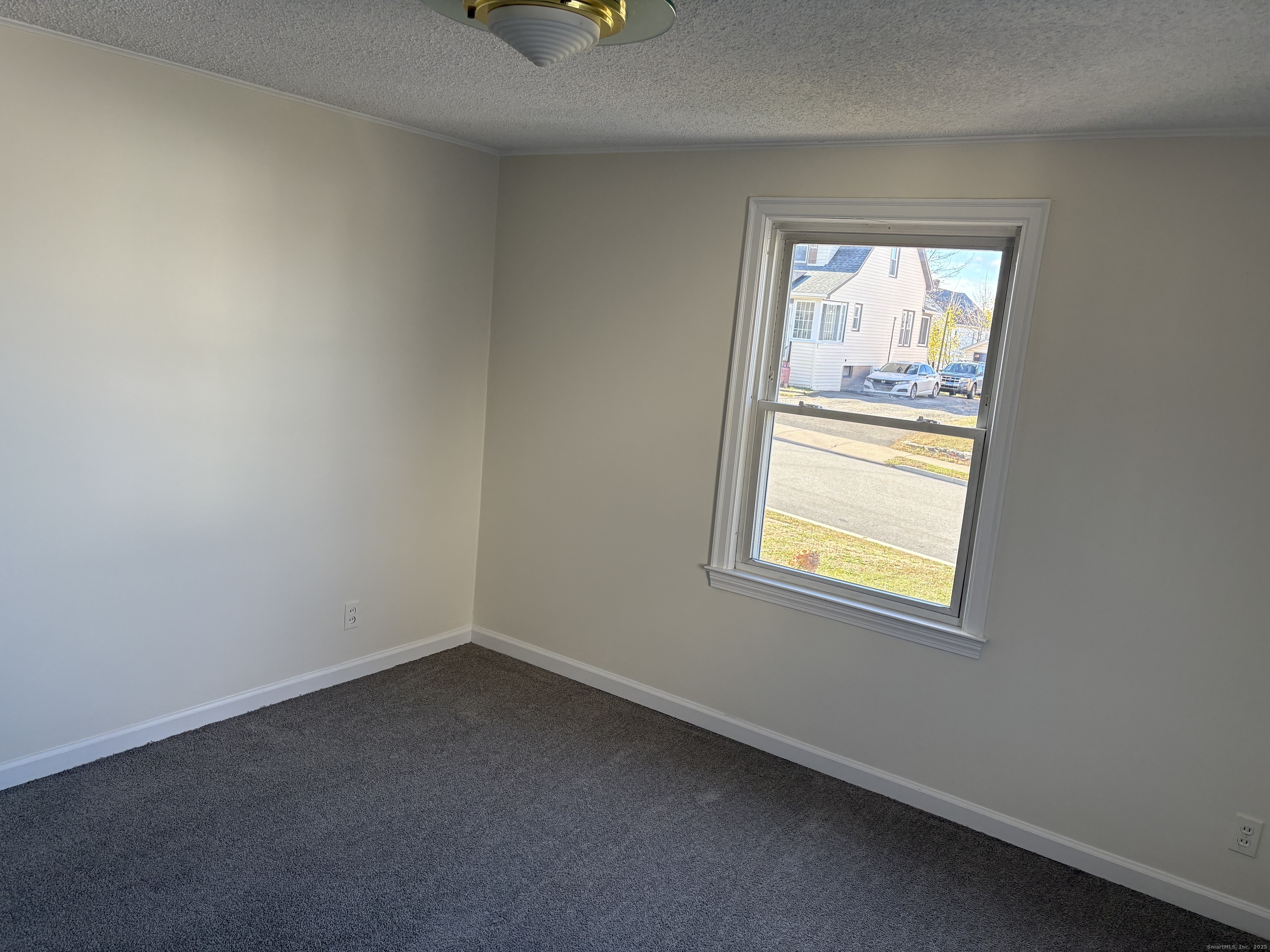 85 Benton Street Manchester, CT 06040 - Photo 10 of 34 an empty room with windows