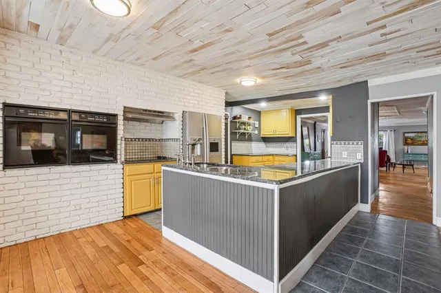 a kitchen with sink cabinets and window