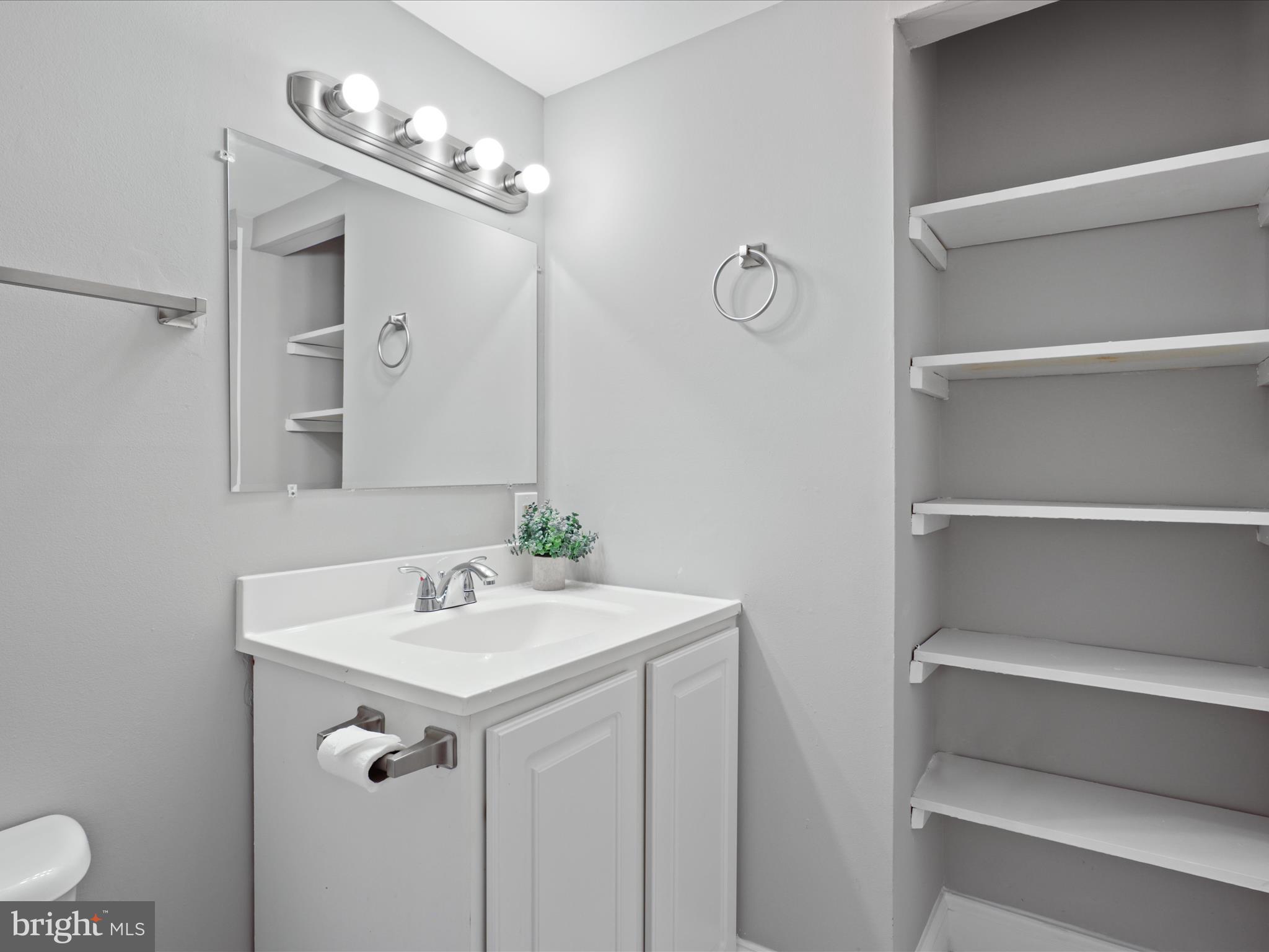 8316 Tobin Road, Unit 831611 Annandale, VA 22003 - Photo 21 of 41 a bathroom with a sink and a mirror