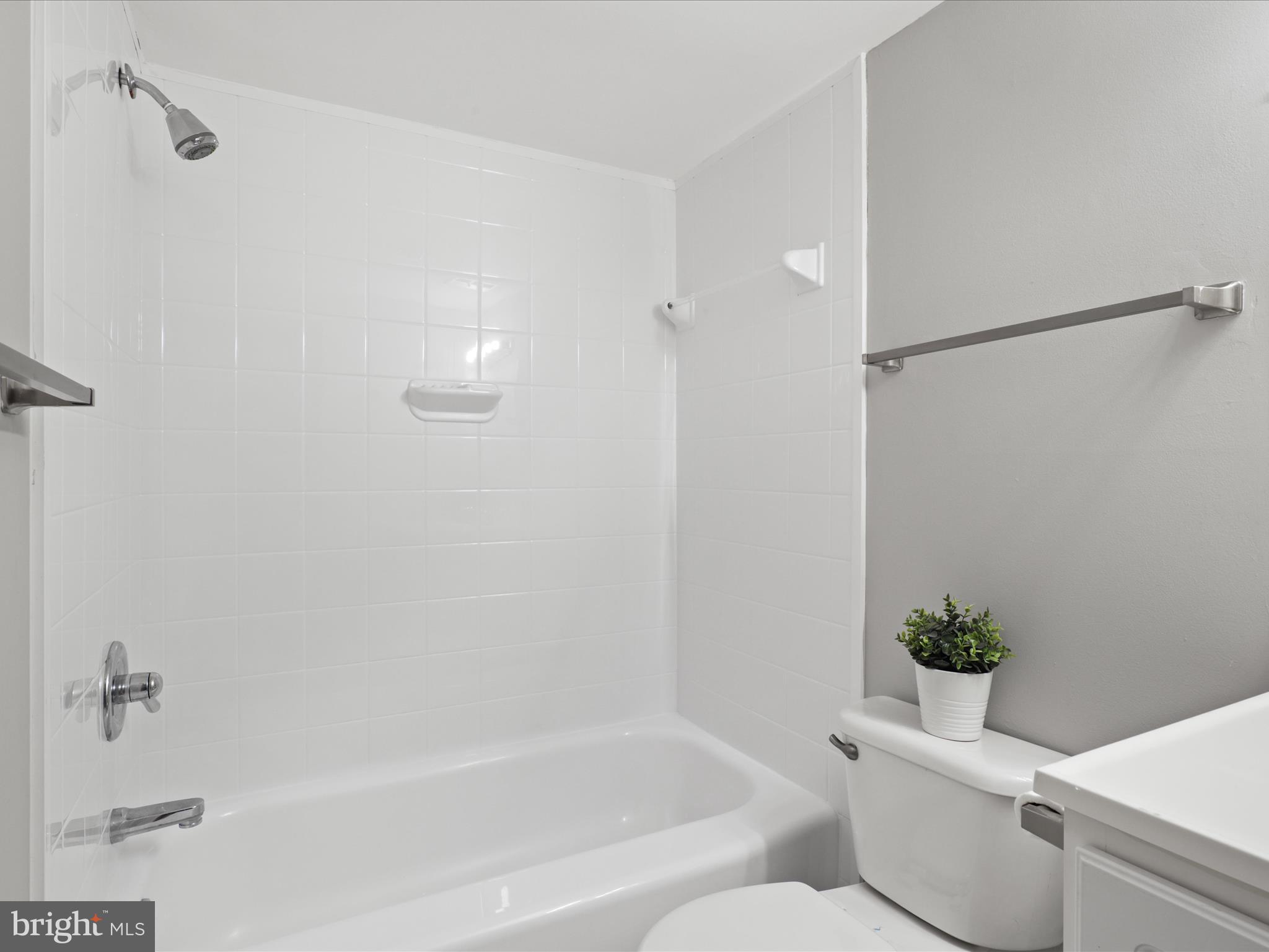 8316 Tobin Road, Unit 831611 Annandale, VA 22003 - Photo 22 of 41 a bath room with a toilet and a bath tub