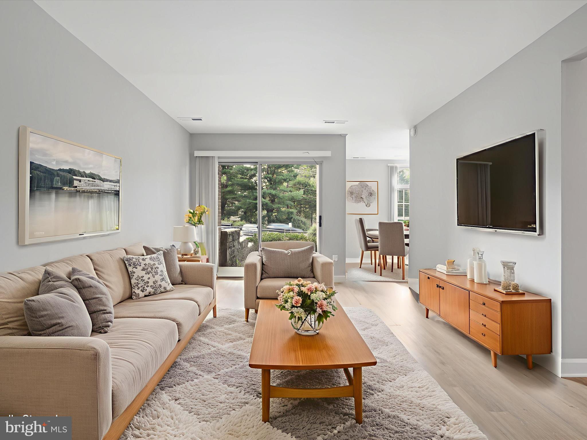 8316 Tobin Road, Unit 831611 Annandale, VA 22003 - Photo 4 of 41 a living room with furniture and a flat screen tv