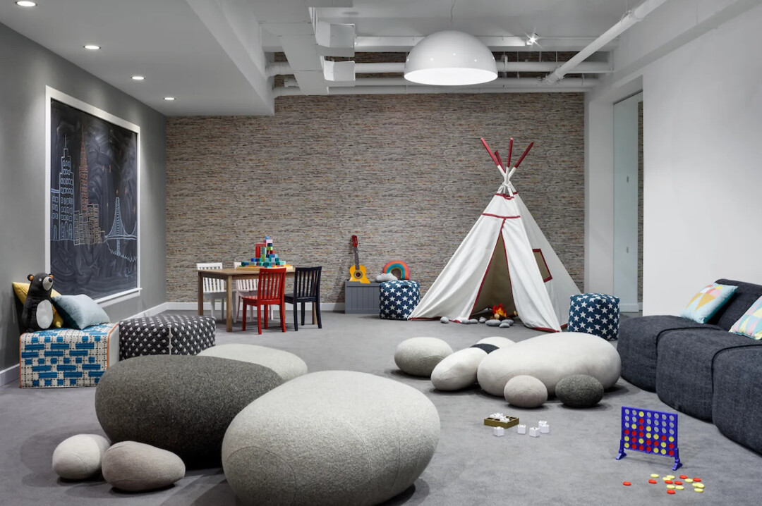 88 Lexington Avenue, Unit 1506 Manhattan, NY 10010 - Photo 12 of 16 a living room with furniture and a large window